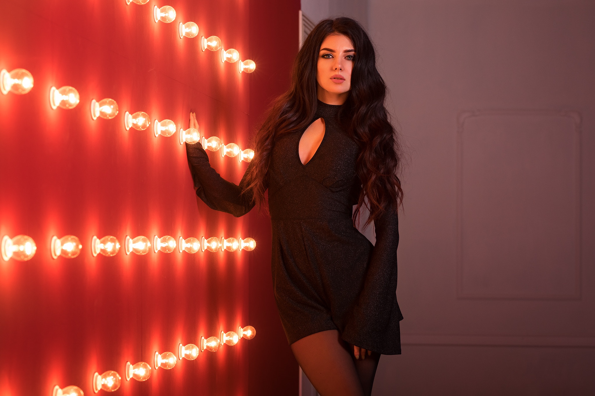 Woman in Elegant Black Dress with Wavy Hair HD Wallpaper