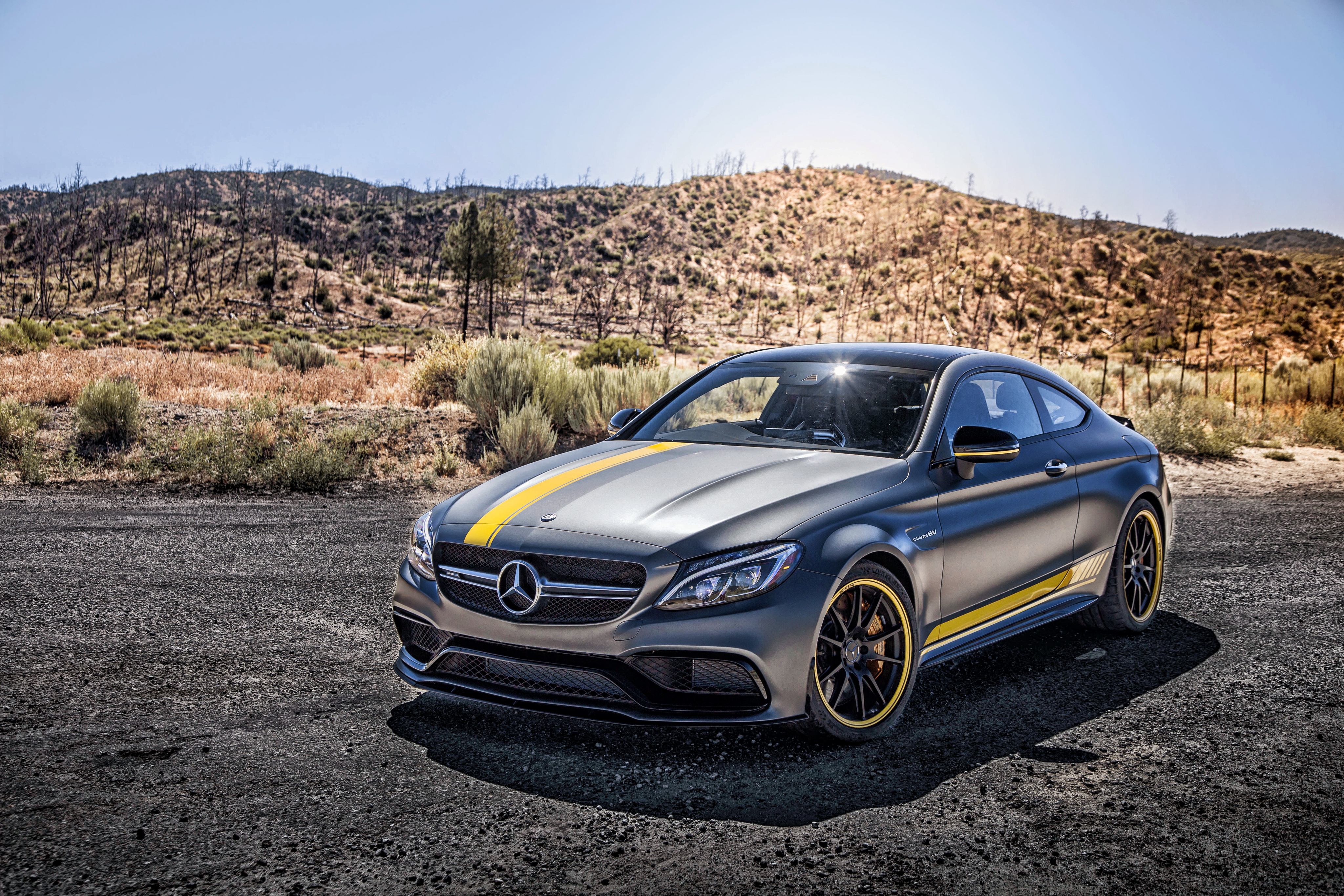 Mercedes-Benz C-Class coupe with yellow stripes in desert HD Wallpaper