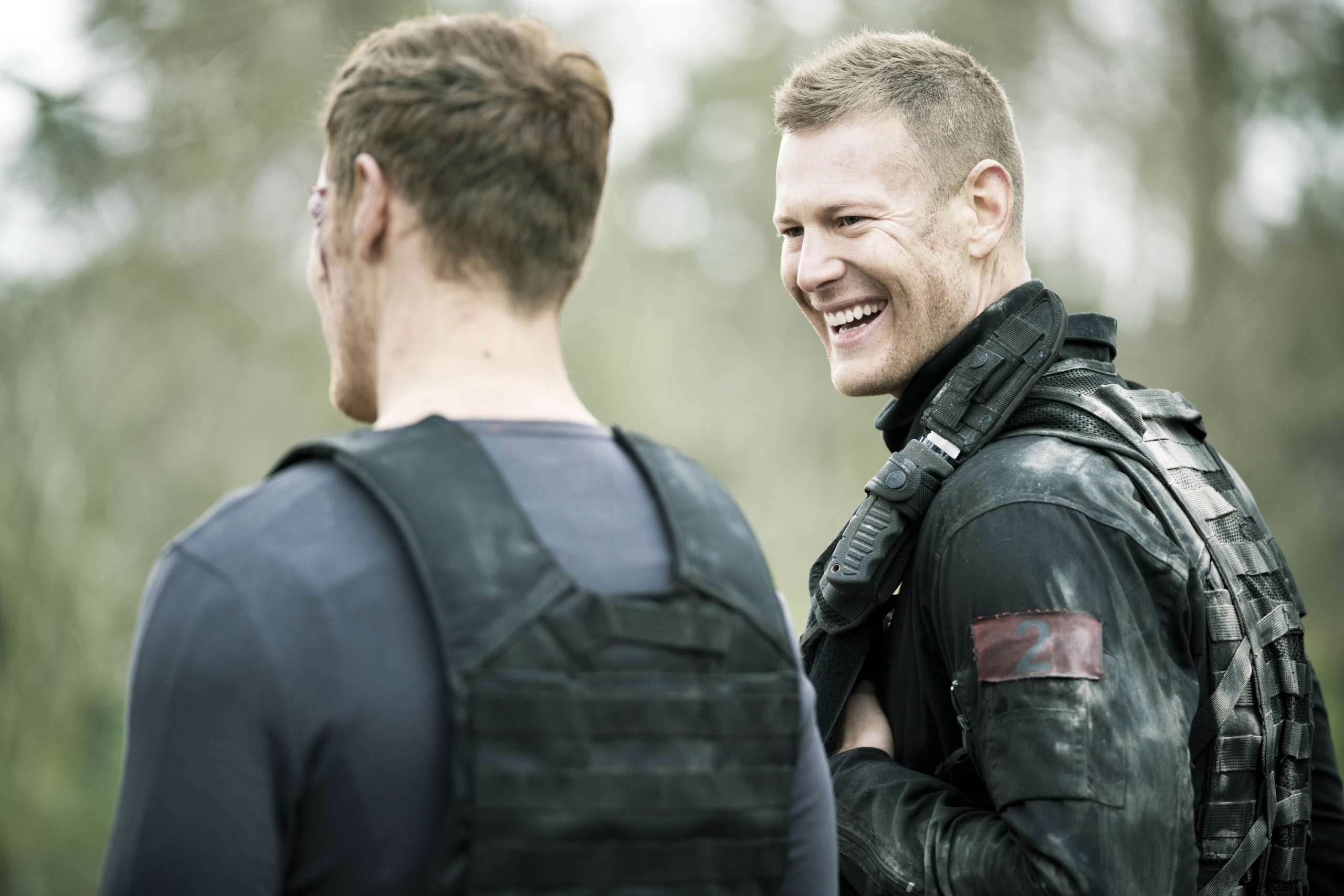 Sam Heughan laughs with fellow soldier in SAS: Red Notice HD Wallpaper
