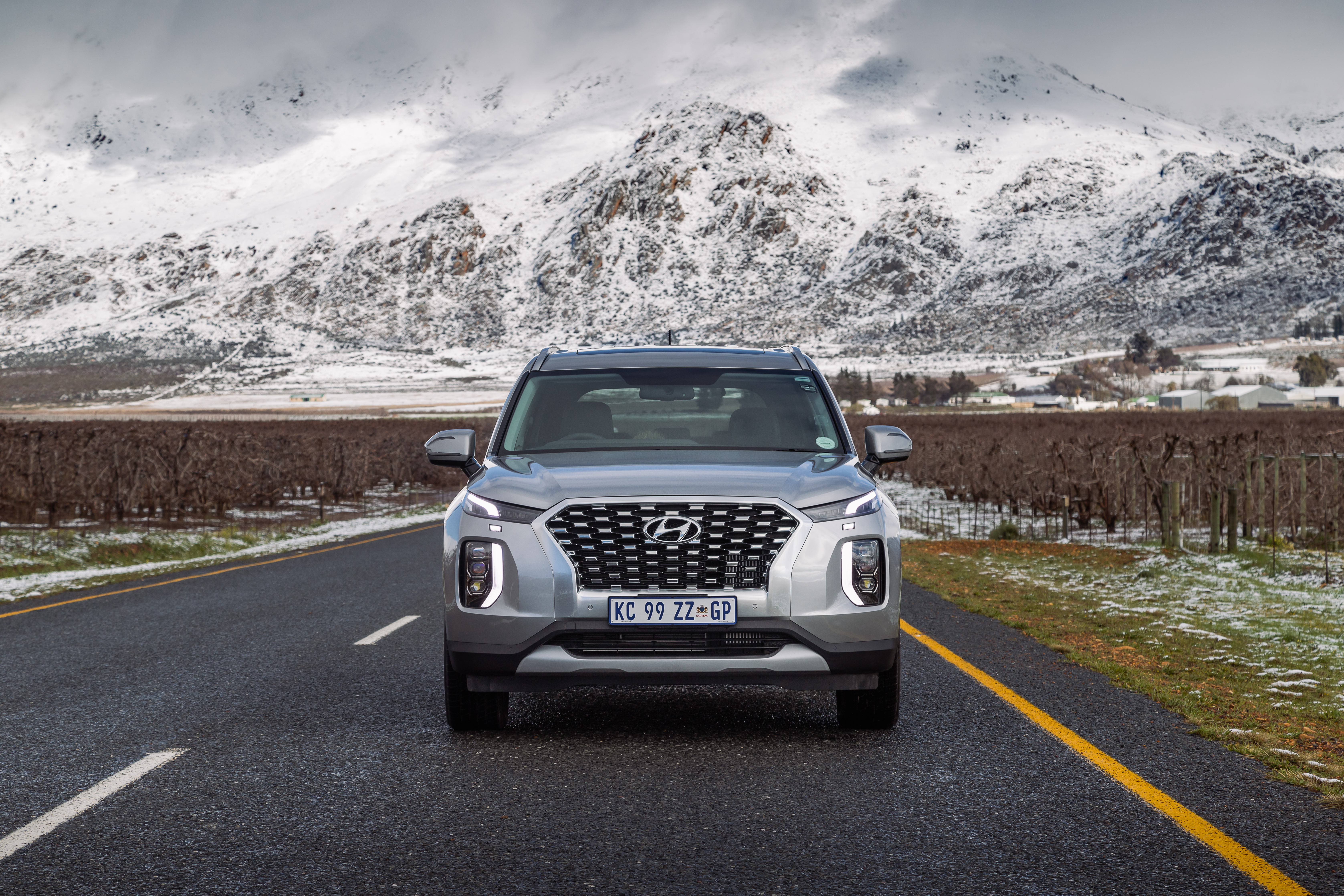 Hyundai Palisade SUV in snowy mountain landscape HD Wallpaper