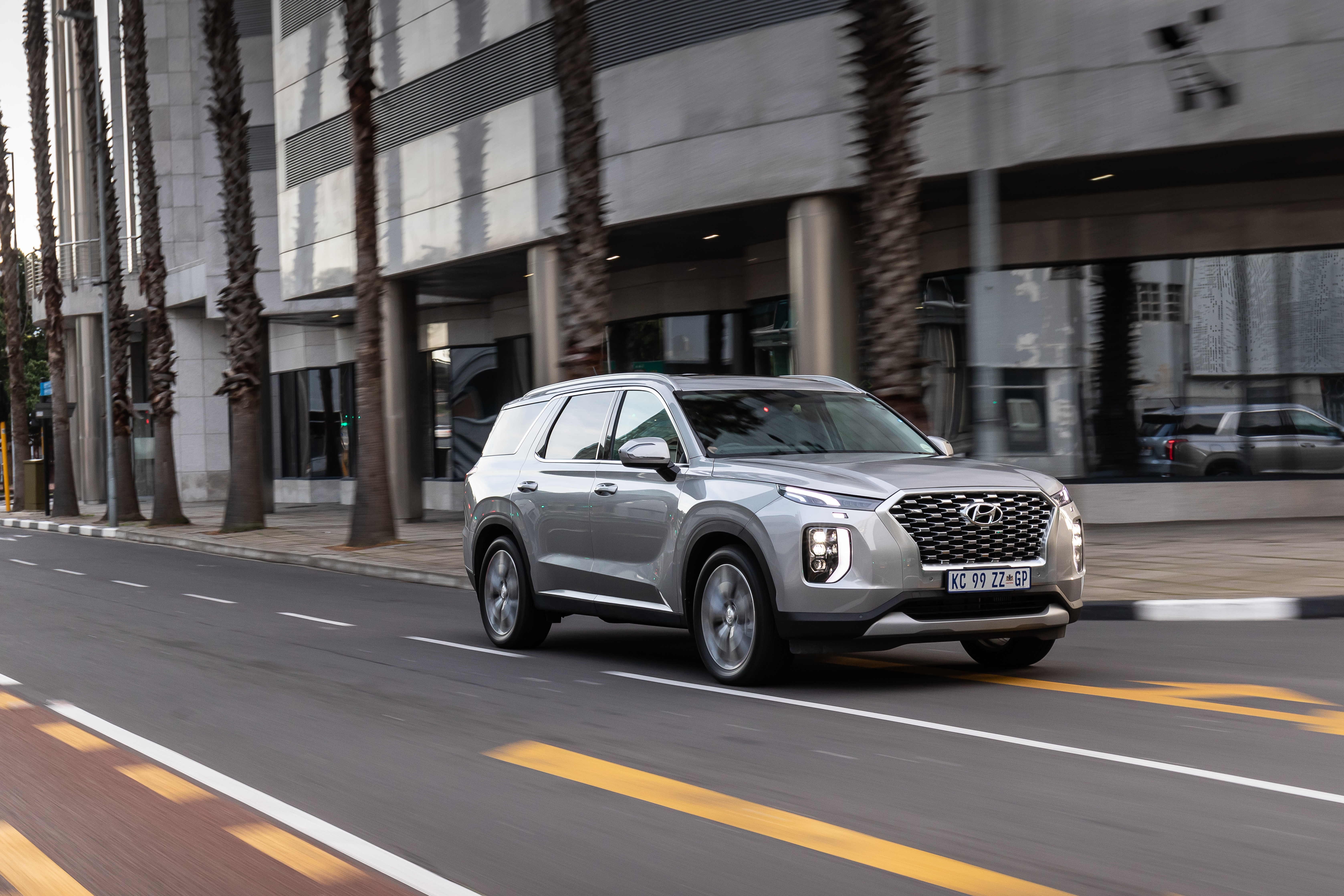 Hyundai Palisade 4K SUV driving on city street HD Wallpaper