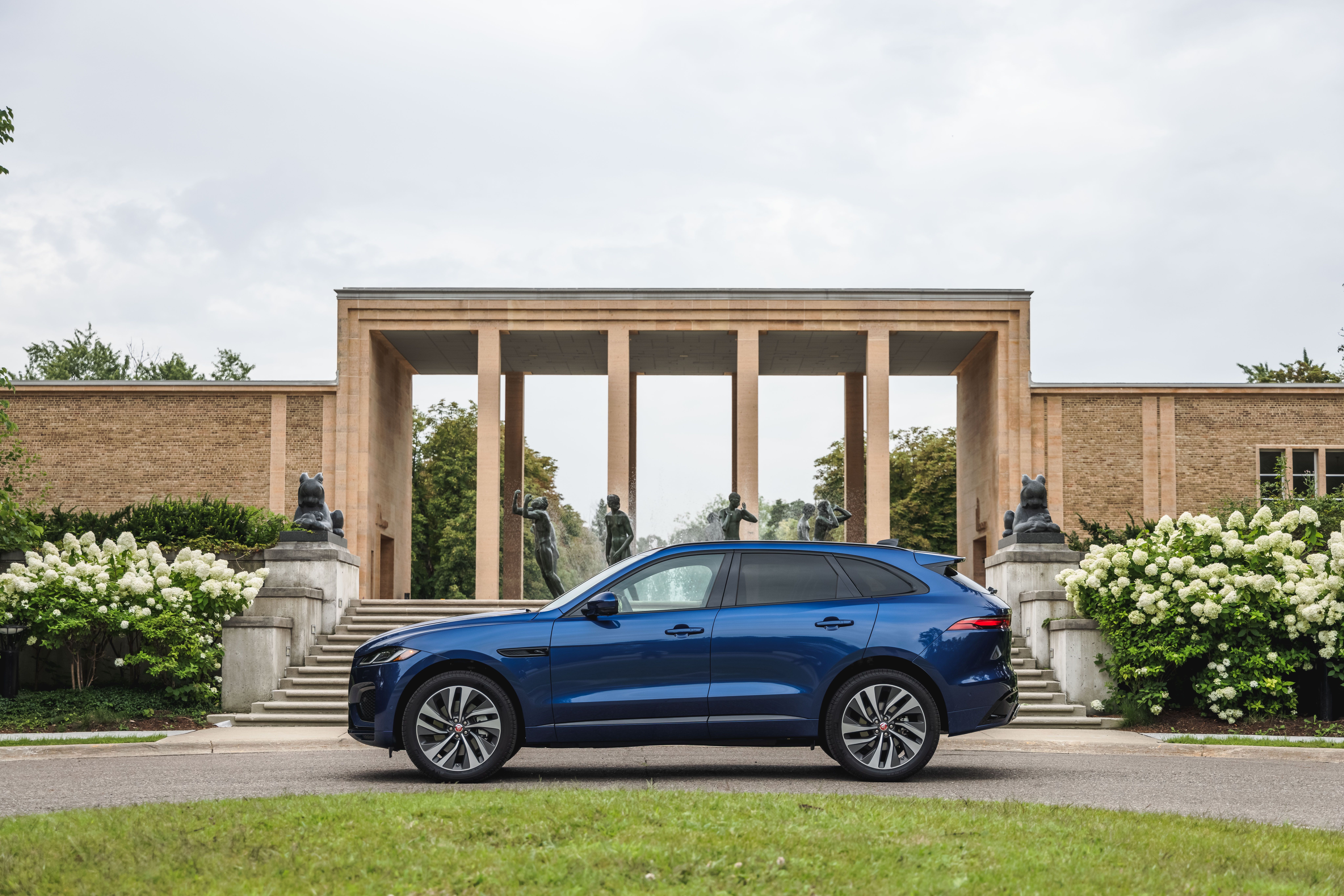 Blue Jaguar F-Pace SUV at a grand building HD Wallpaper
