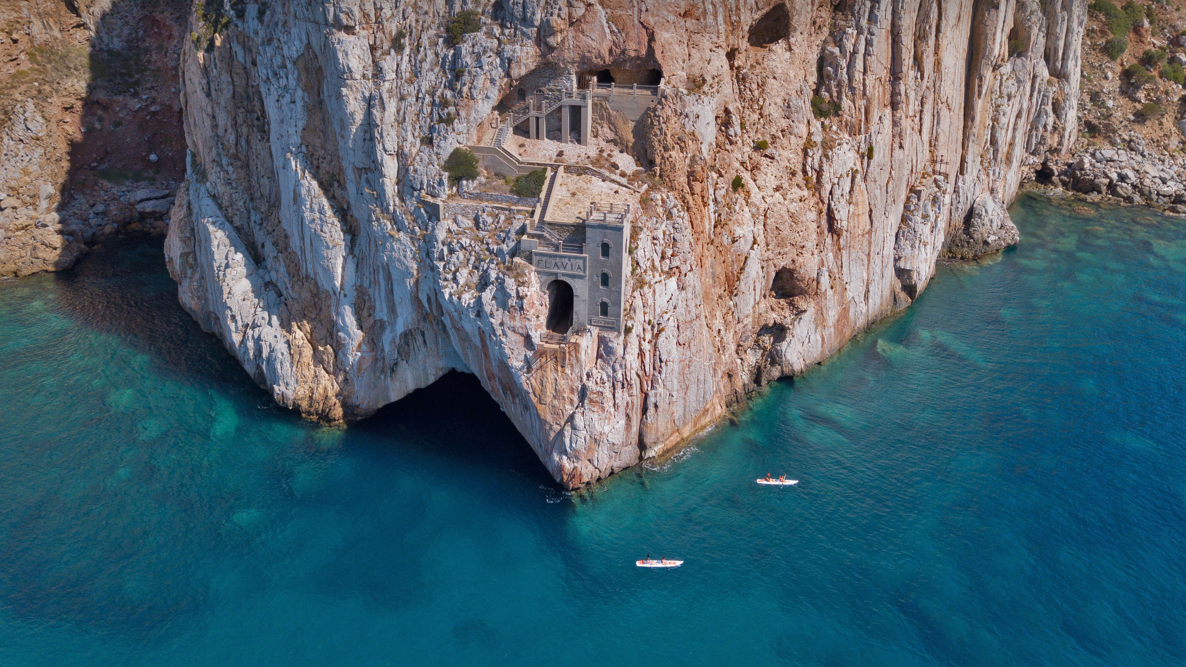 Porto Flavia, Sardinia: Cliffside architecture and clear waters HD Wallpaper