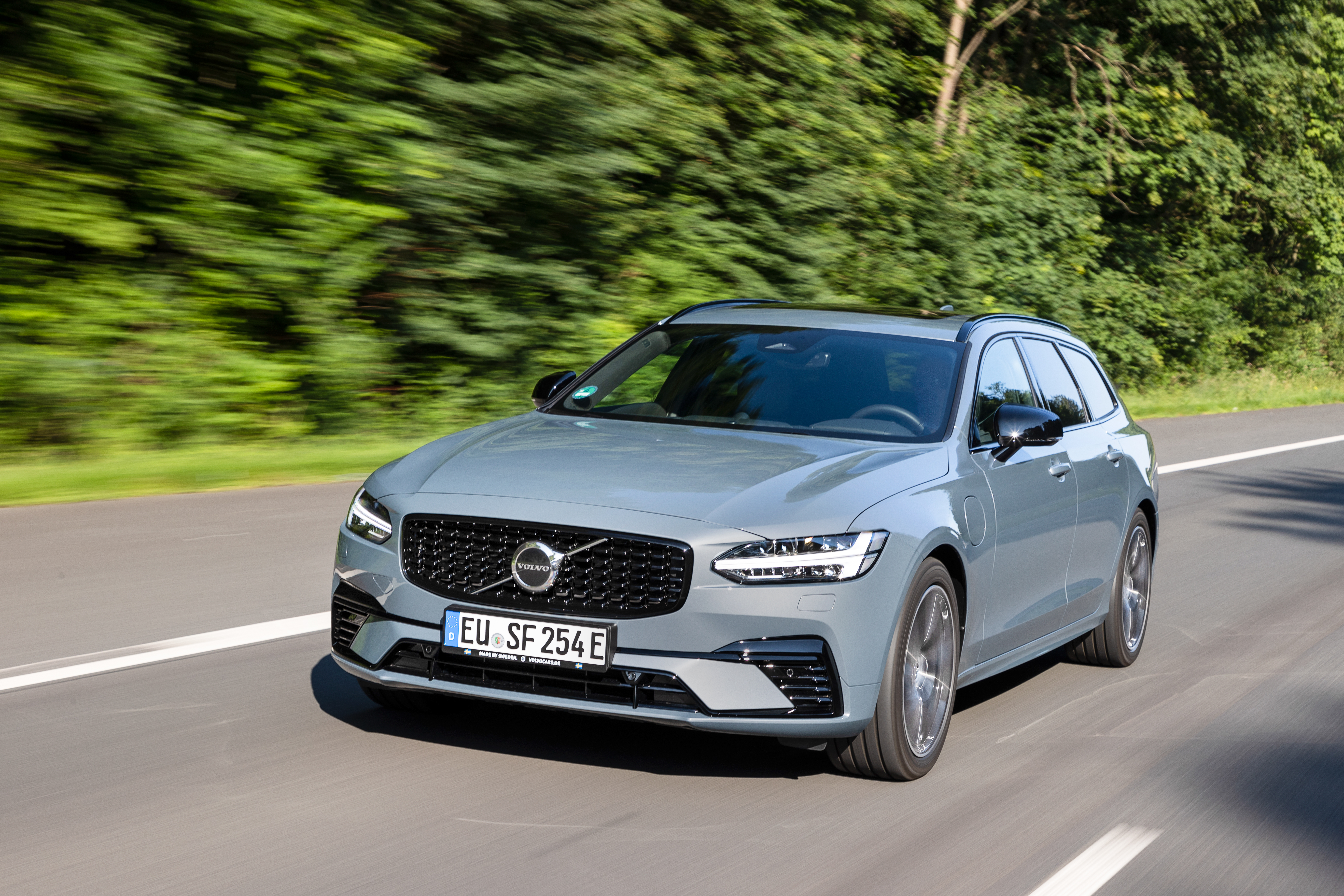 Volvo V90 T6 AWD Recharge R-Design driving on road HD Wallpaper