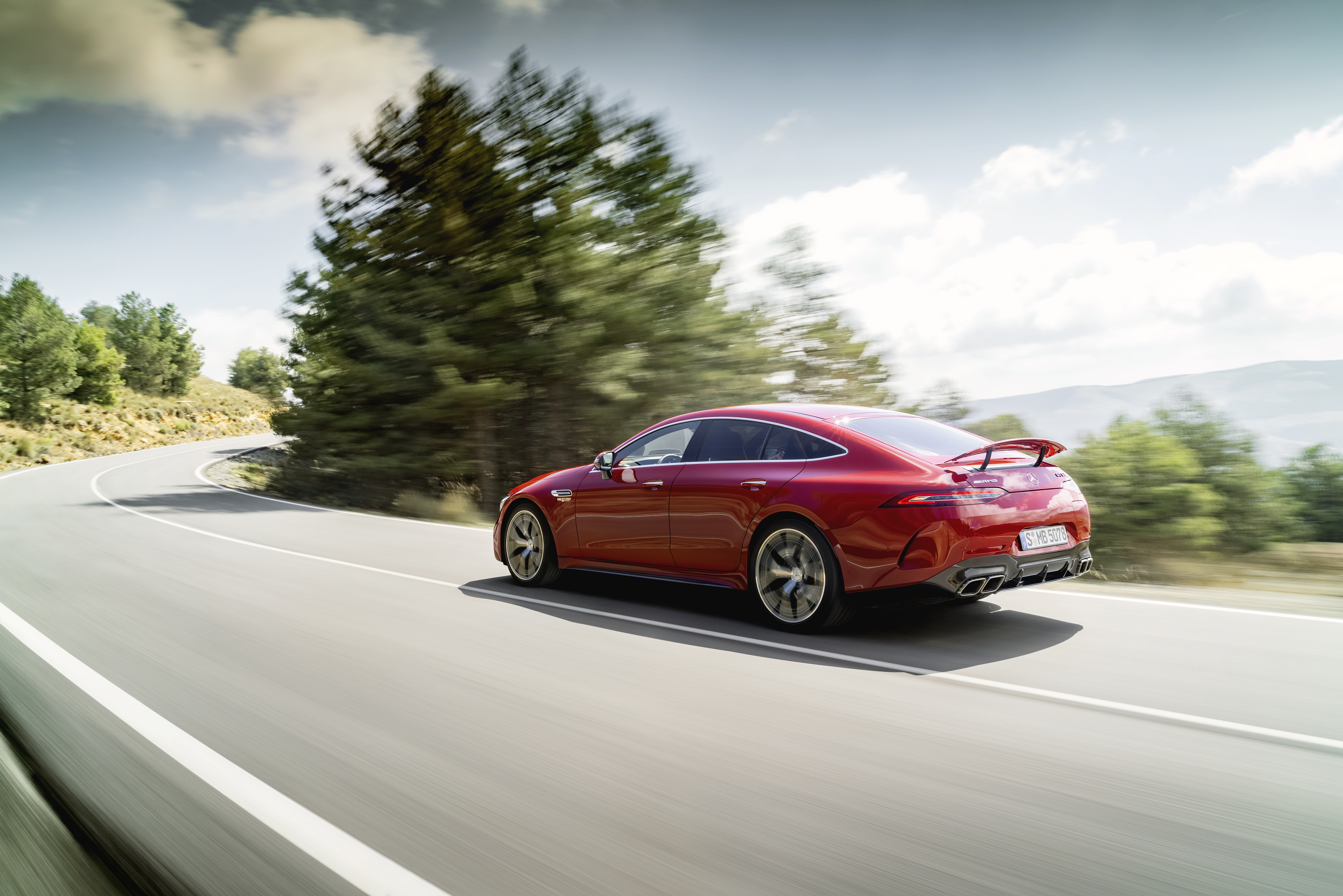 Red Mercedes-AMG GT 63 S E Performance on a winding road HD Wallpaper