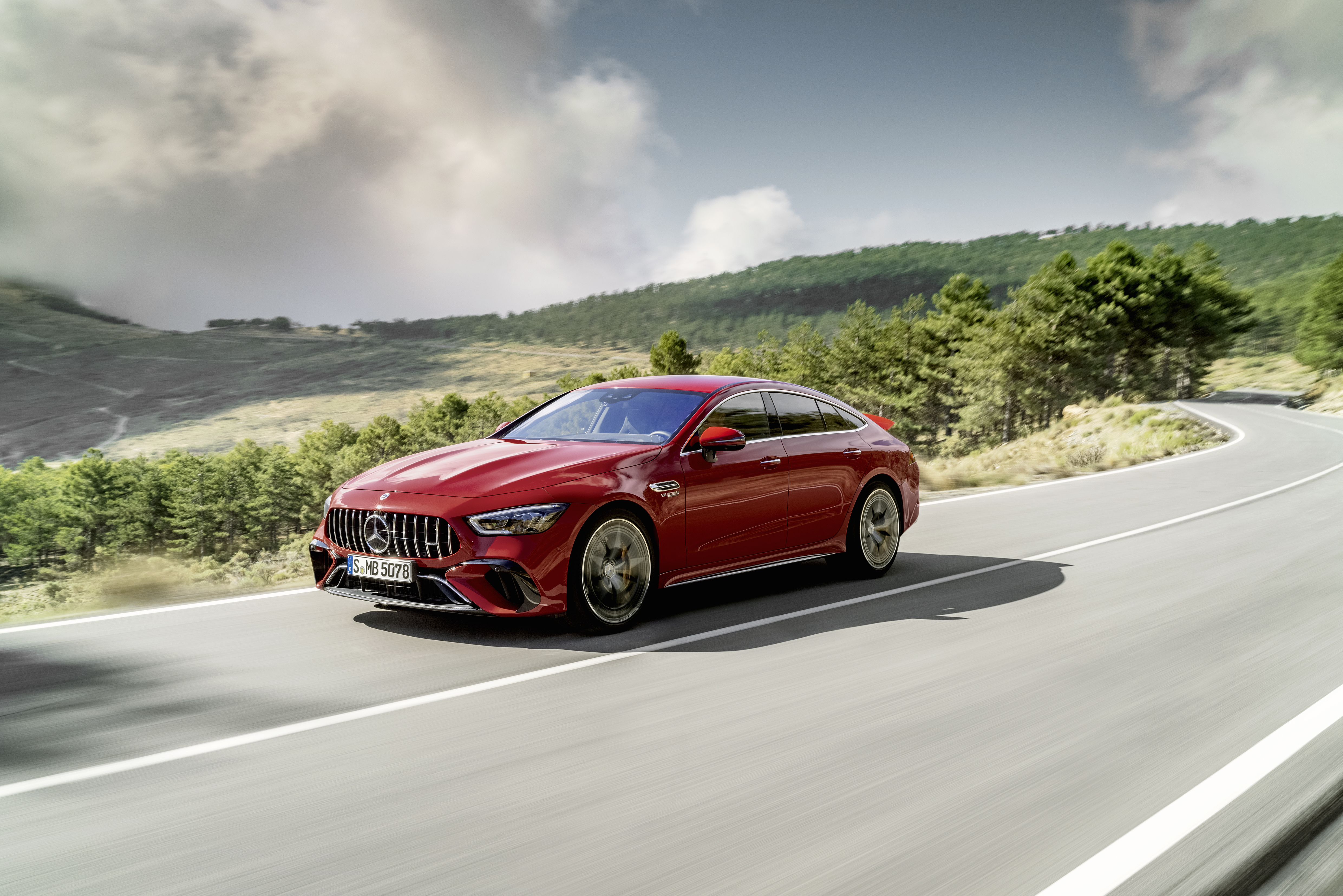 Red Mercedes-AMG GT 63 S E Performance on a scenic road HD Wallpaper