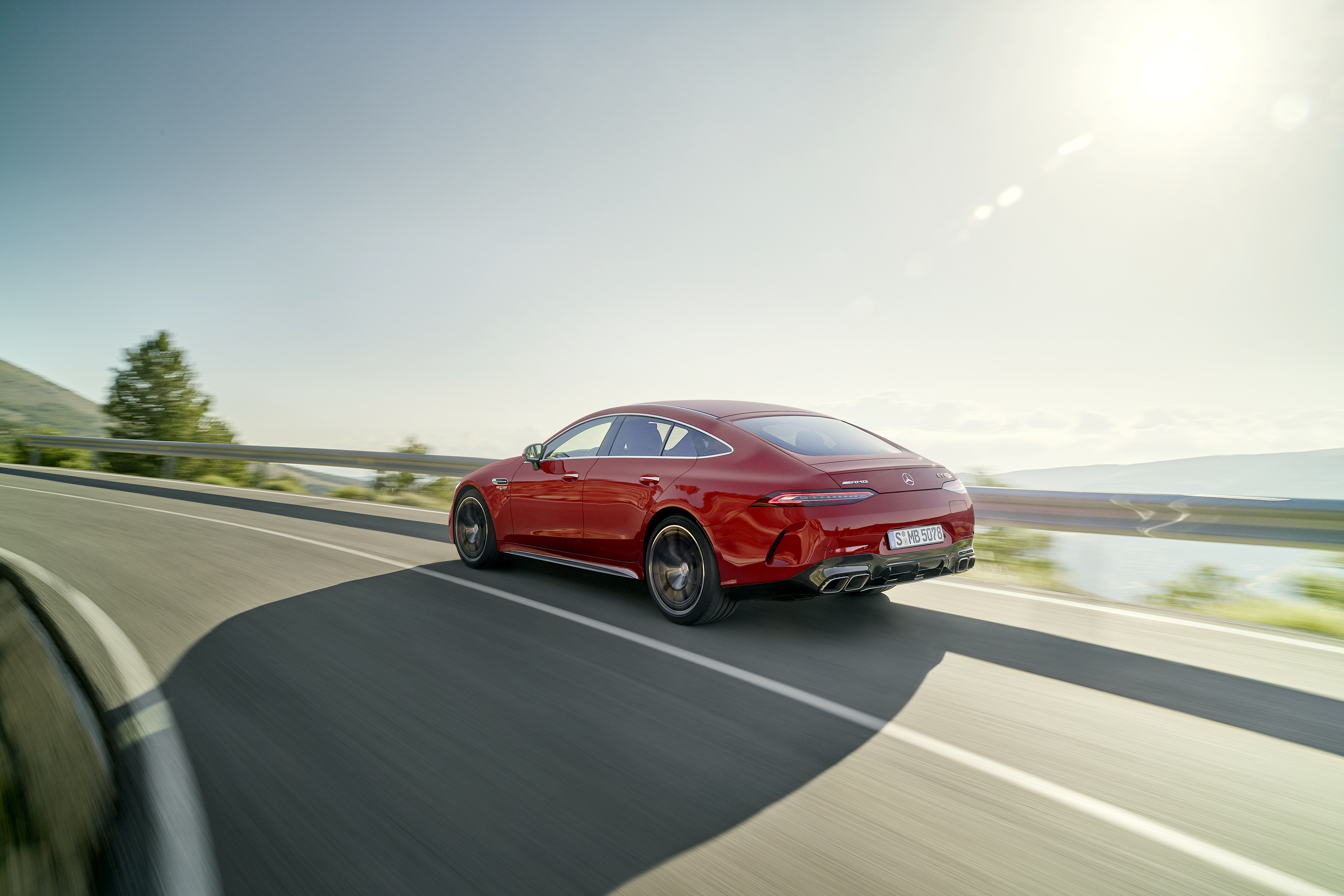 Red Mercedes-AMG GT 63 S E Performance on a winding road HD Wallpaper