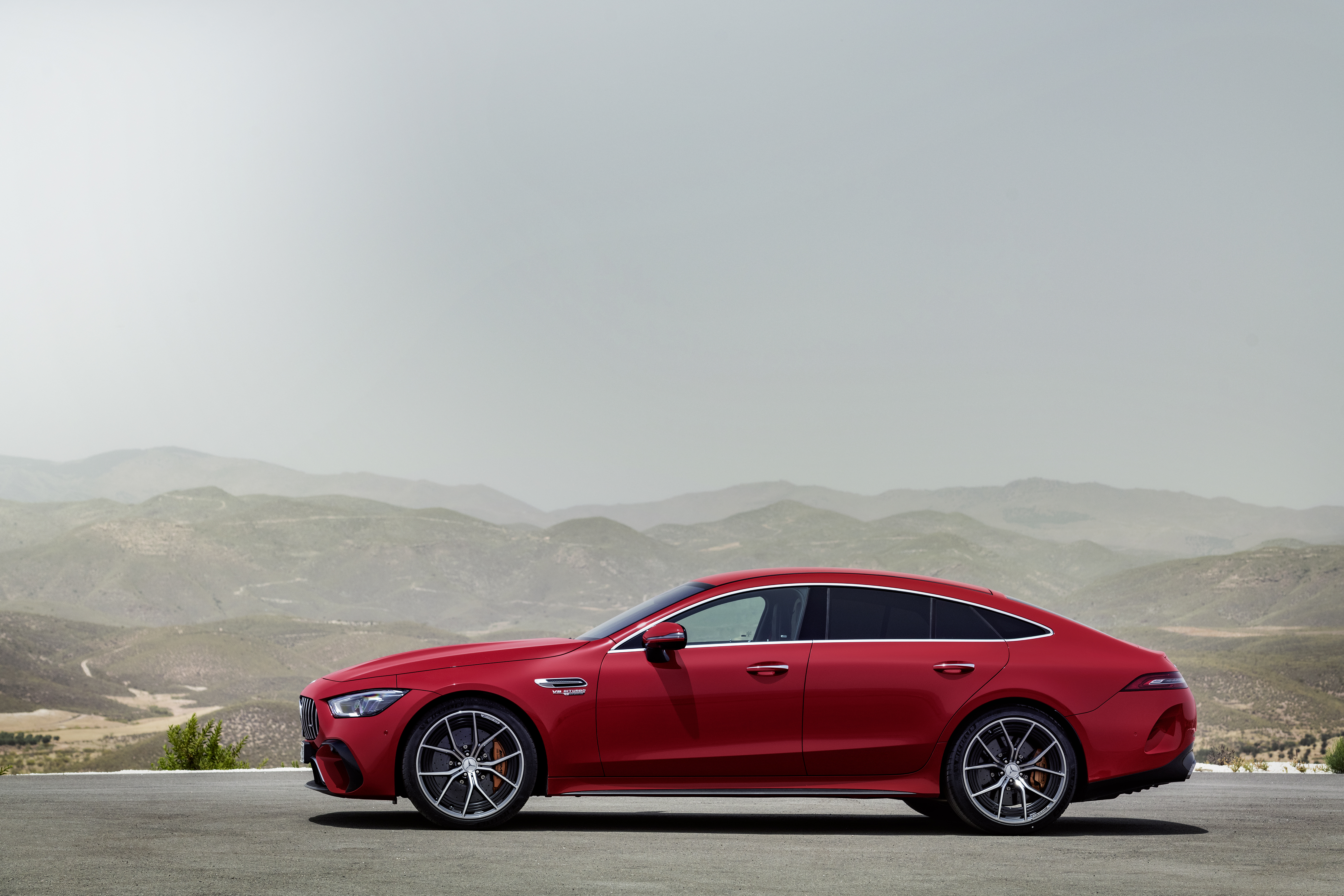 Red Mercedes-AMG GT 63 S Luxury Grand Tourer in mountains HD Wallpaper