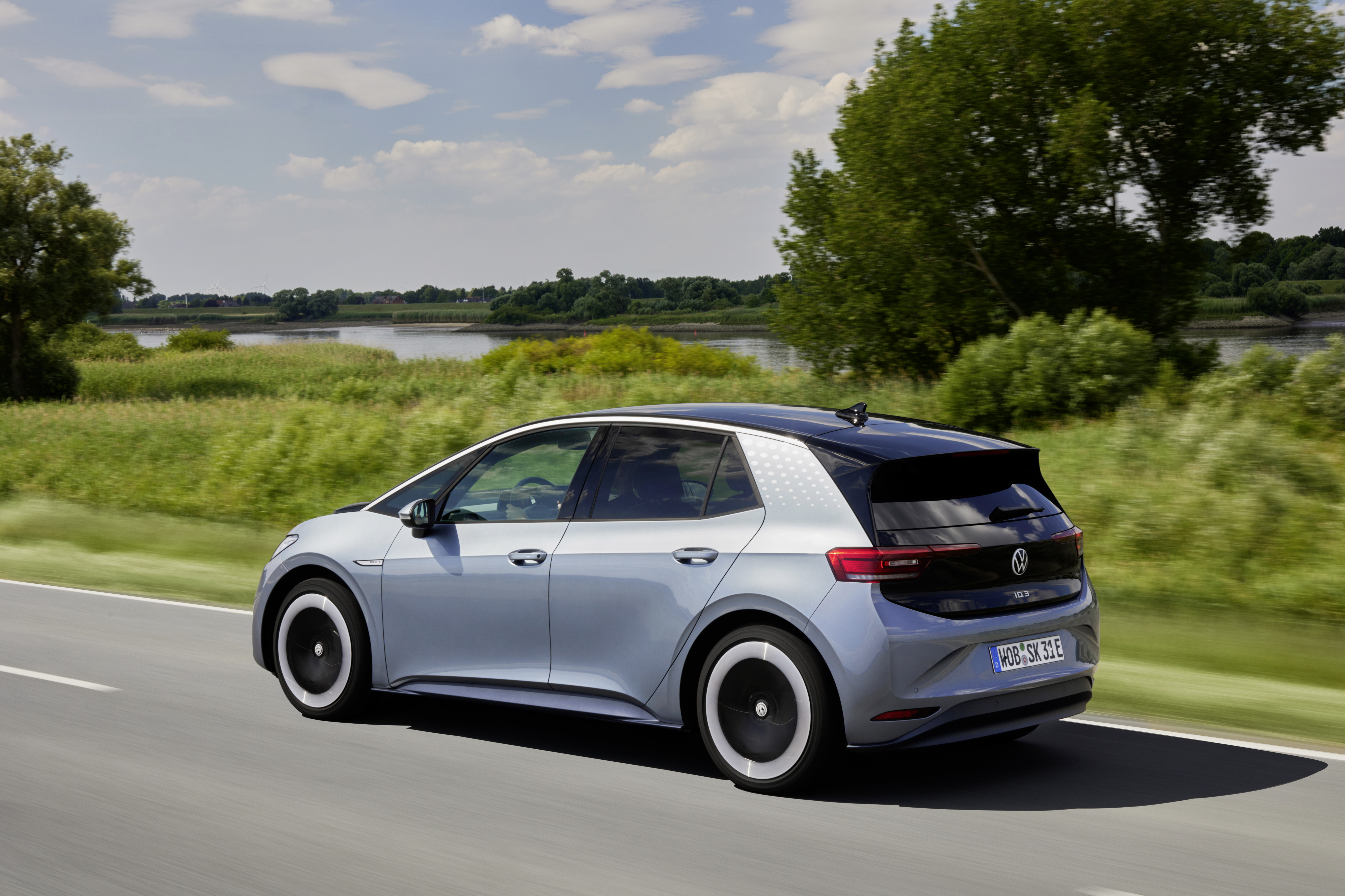 Volkswagen ID.3 Pro S electric car driving on a road HD Wallpaper