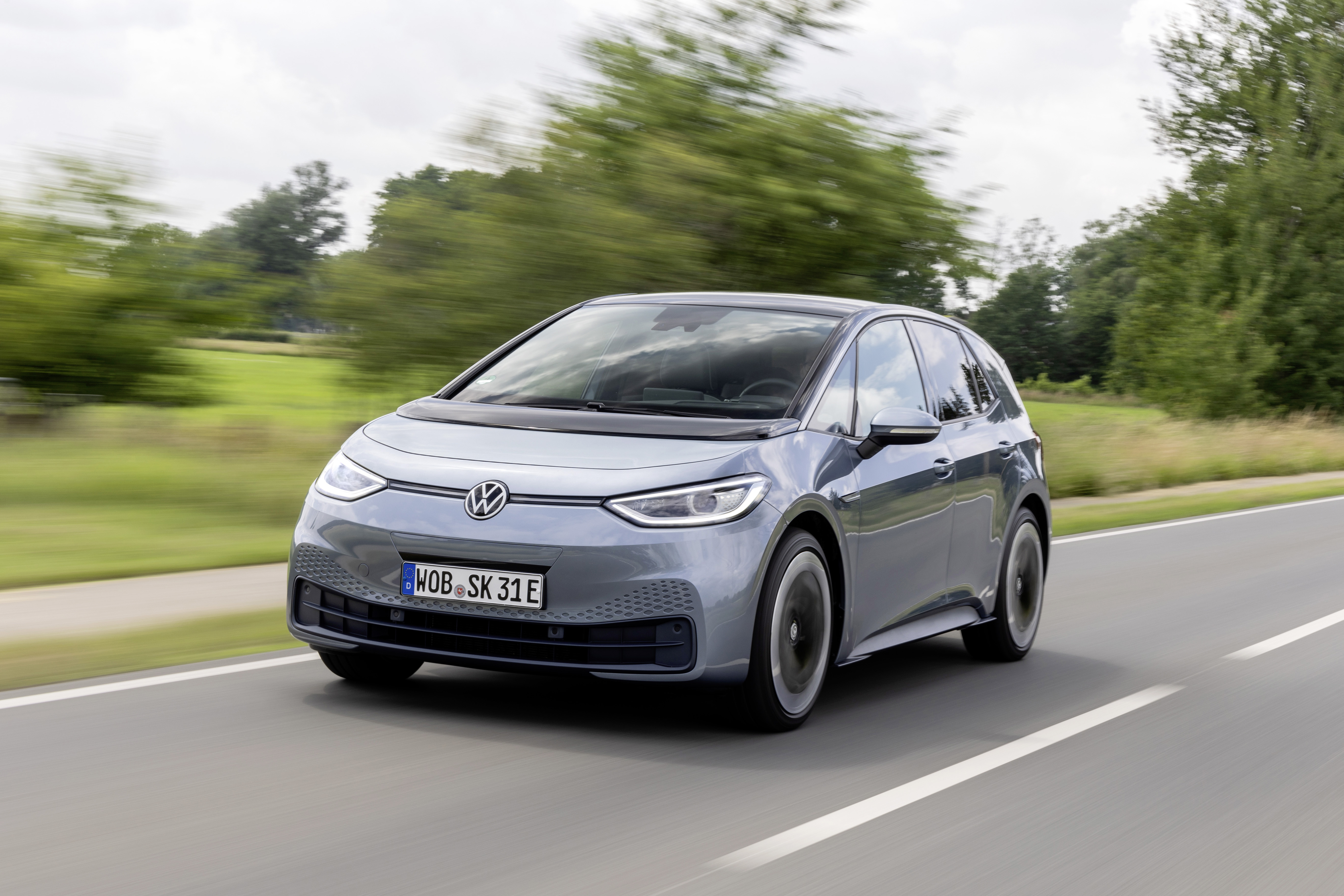 Volkswagen ID.3 Pro S electric car driving on road HD Wallpaper