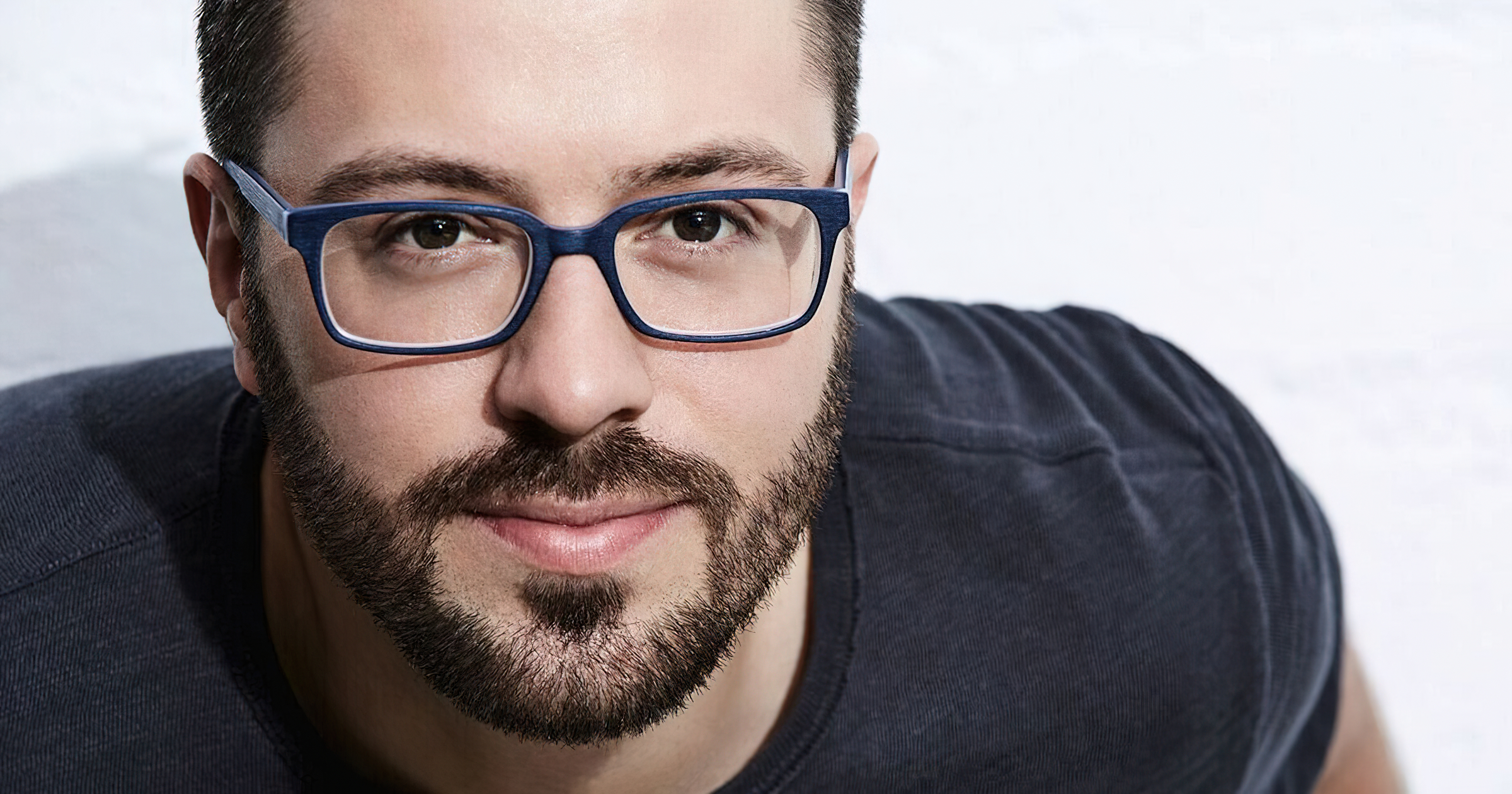Danny Gokey smiling with beard and blue glasses HD Wallpaper