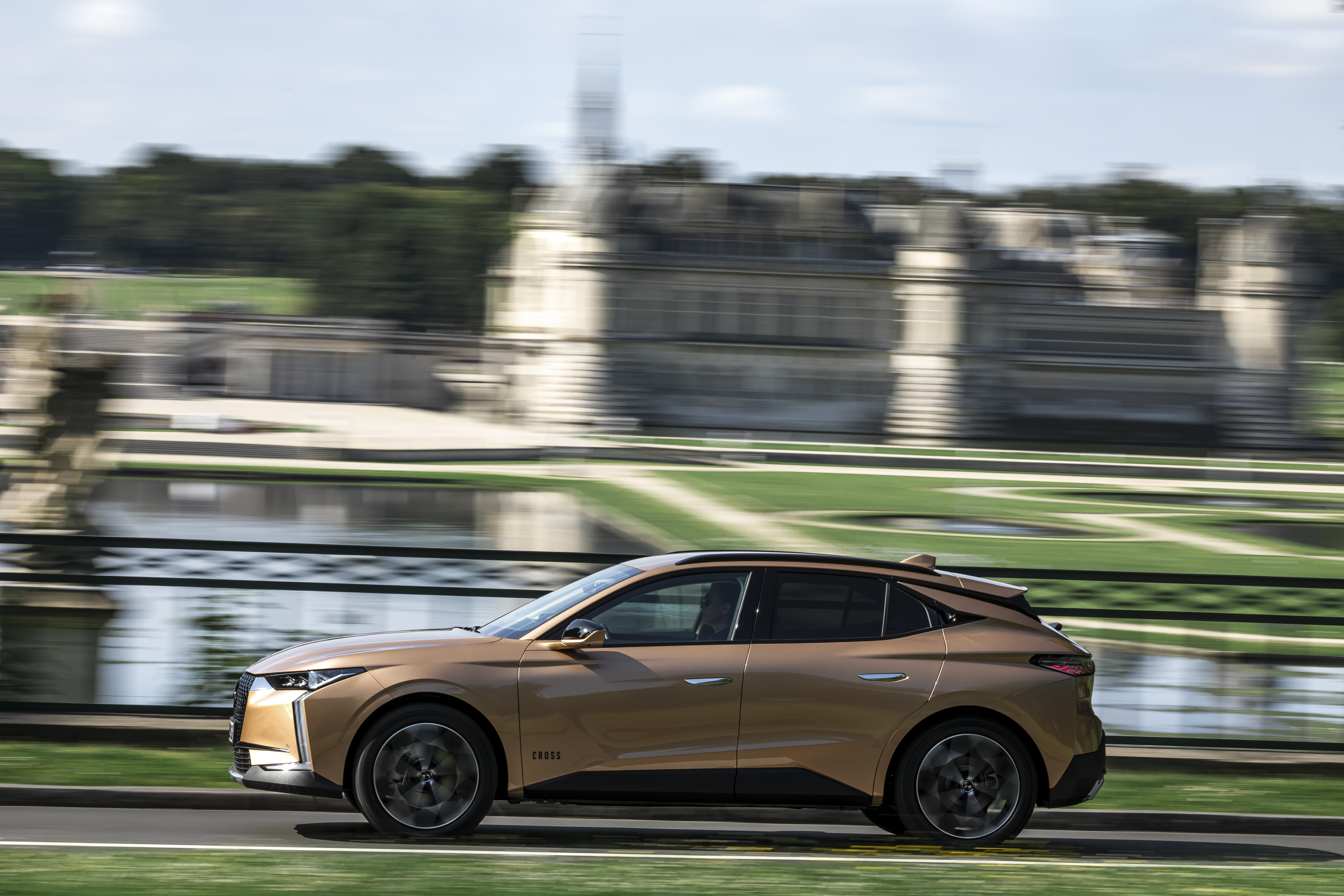 Gold DS 4 Cross SUV in motion HD Wallpaper