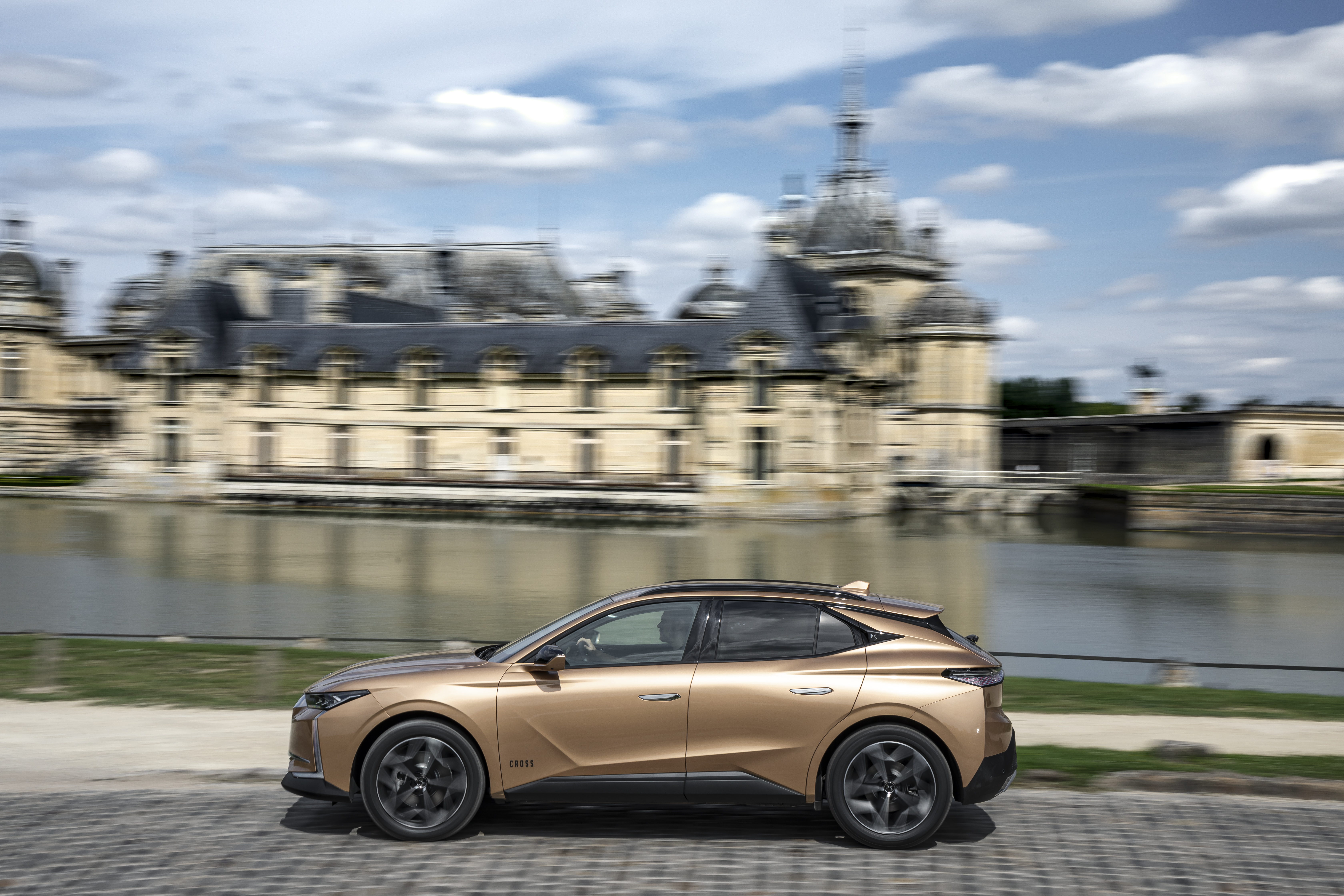 DS 4 Cross SUV driving past a majestic chateau. HD Wallpaper