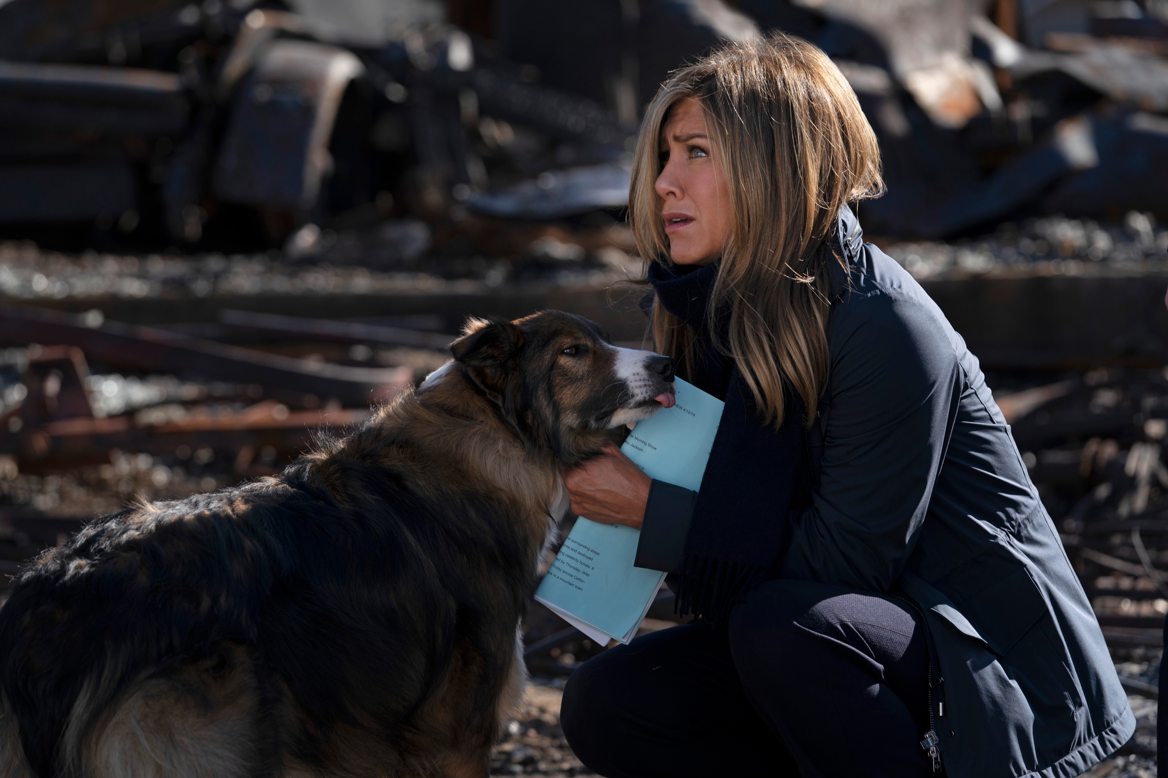 Jennifer Aniston and dog in a somber scene from The Morning Show HD Wallpaper