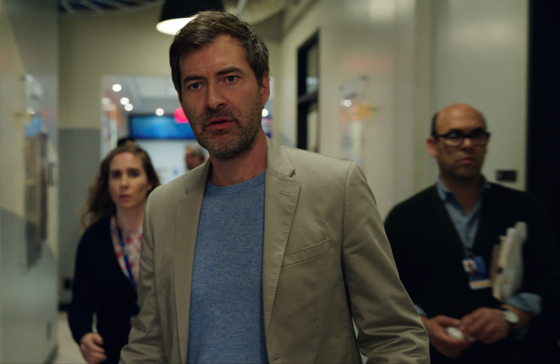 Mark Duplass serious in The Morning Show hallway HD Wallpaper