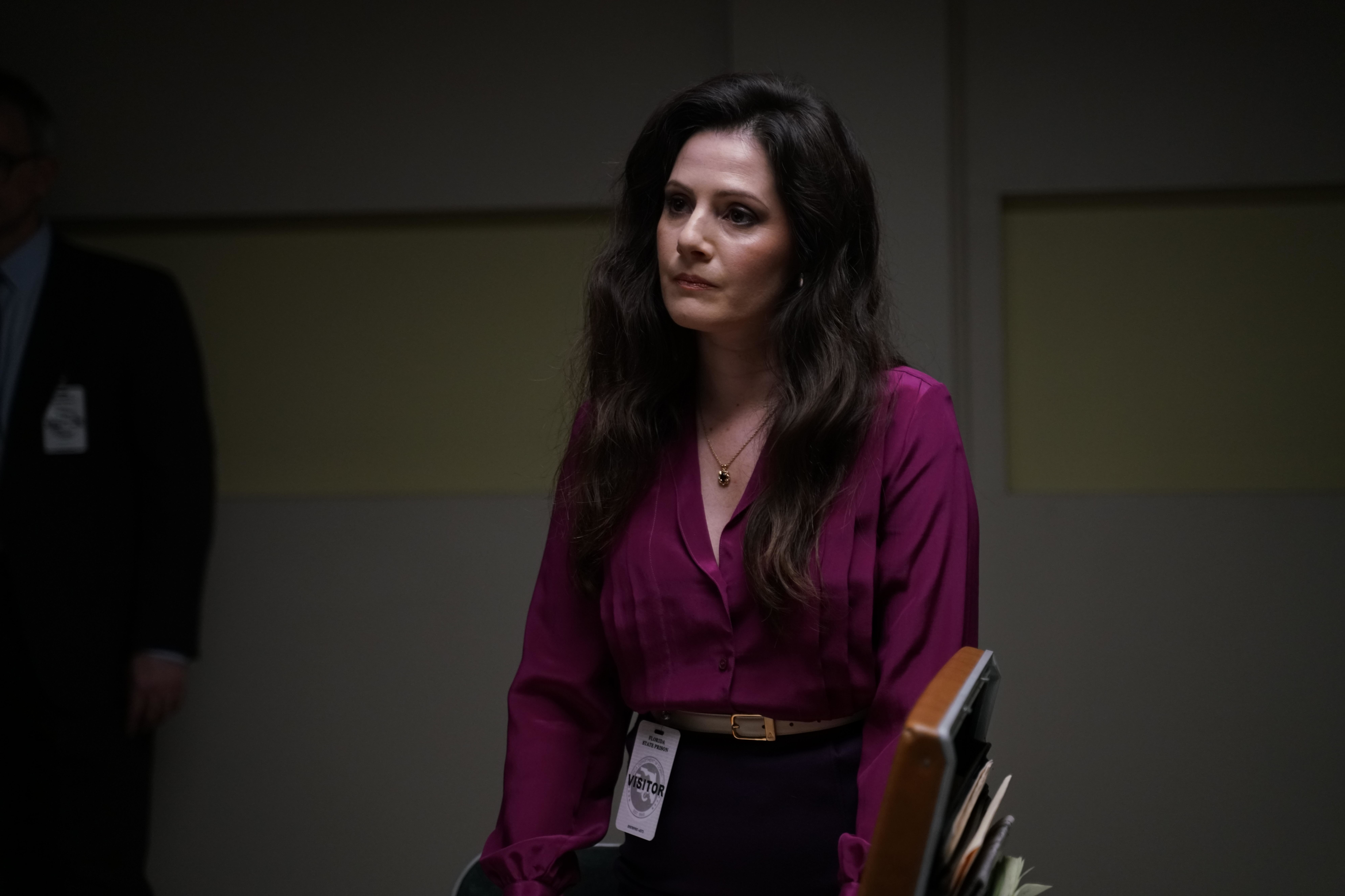 Aleksa Palladino looking serious in purple blouse with visitor badge HD Wallpaper