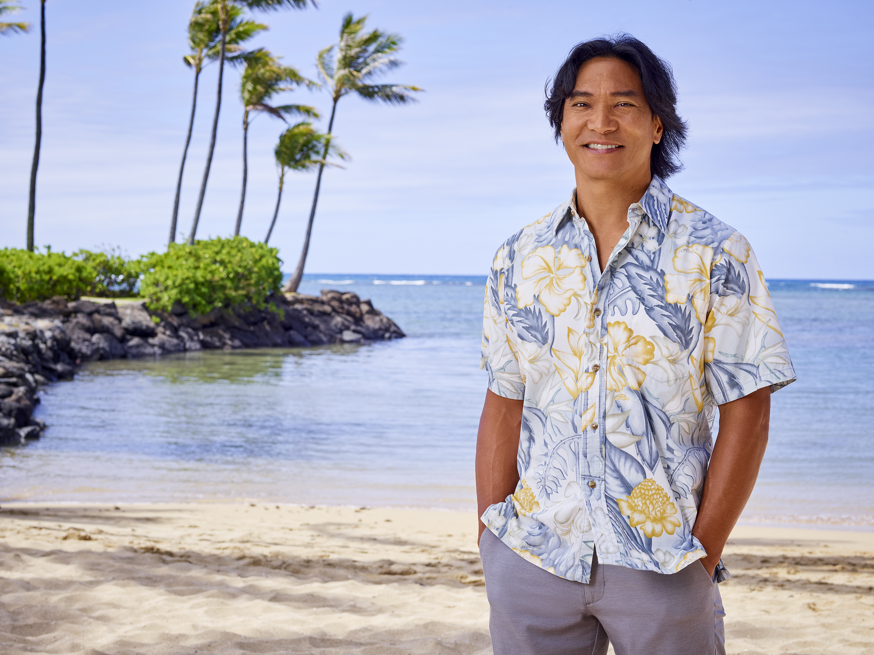 Doogie Kamealoha, M.D. actor smiling on a tropical beach HD Wallpaper