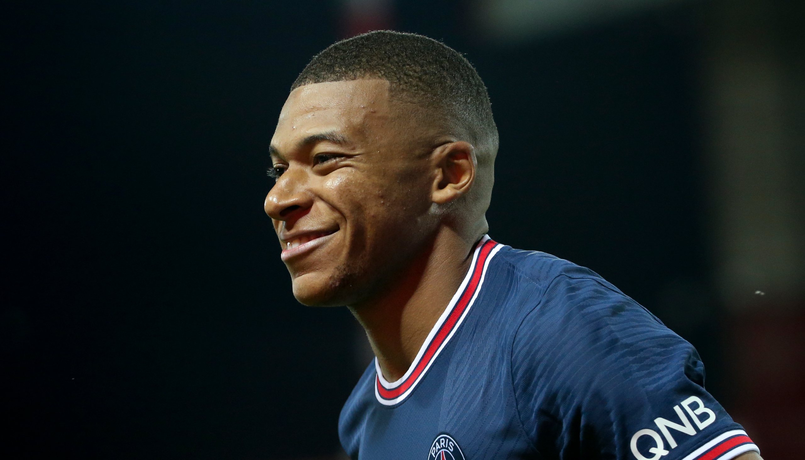 Smiling Kylian Mbappé in PSG jersey HD Wallpaper