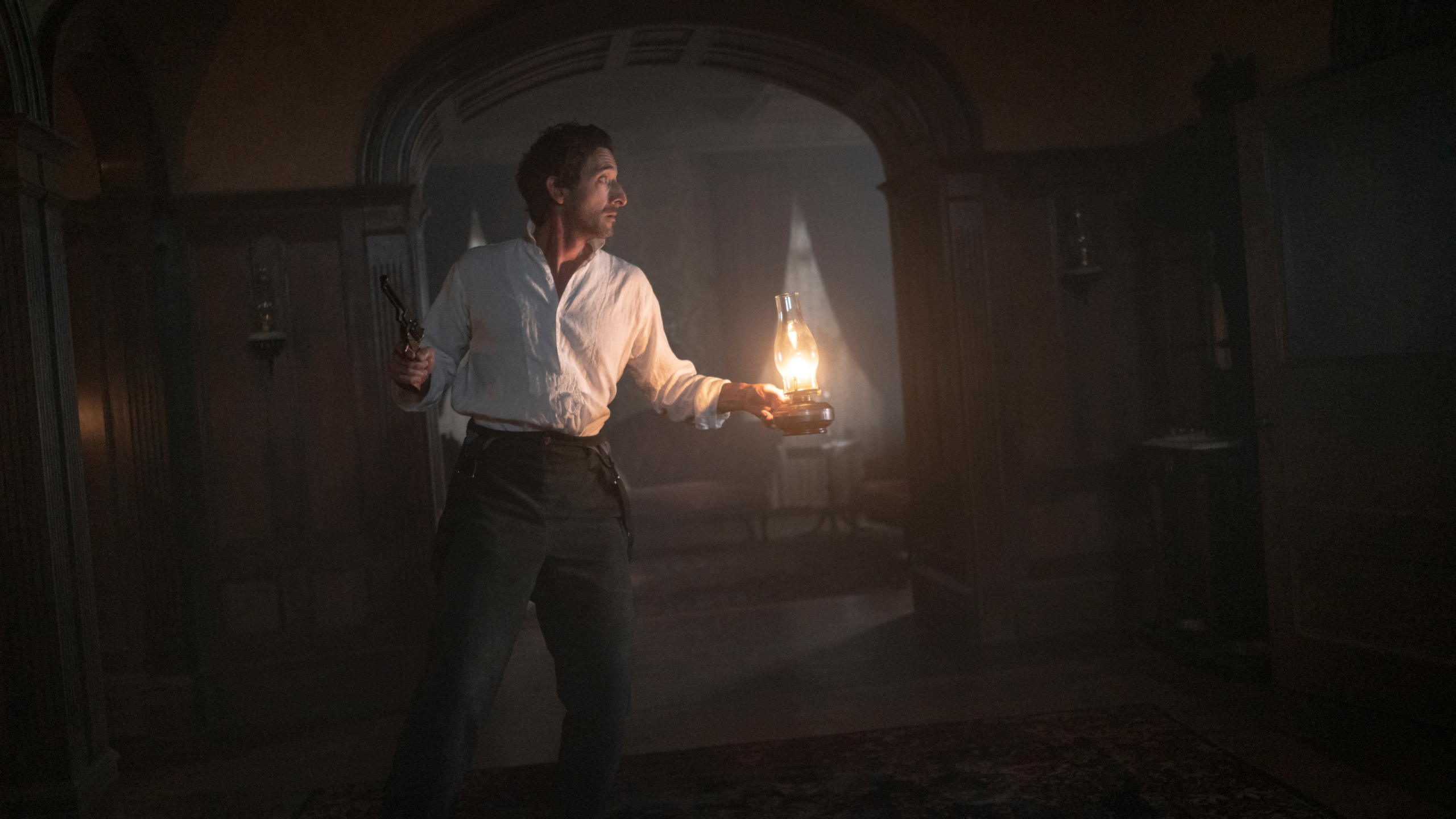 Chapelwaite: Adrien Brody with lantern and revolver HD Wallpaper