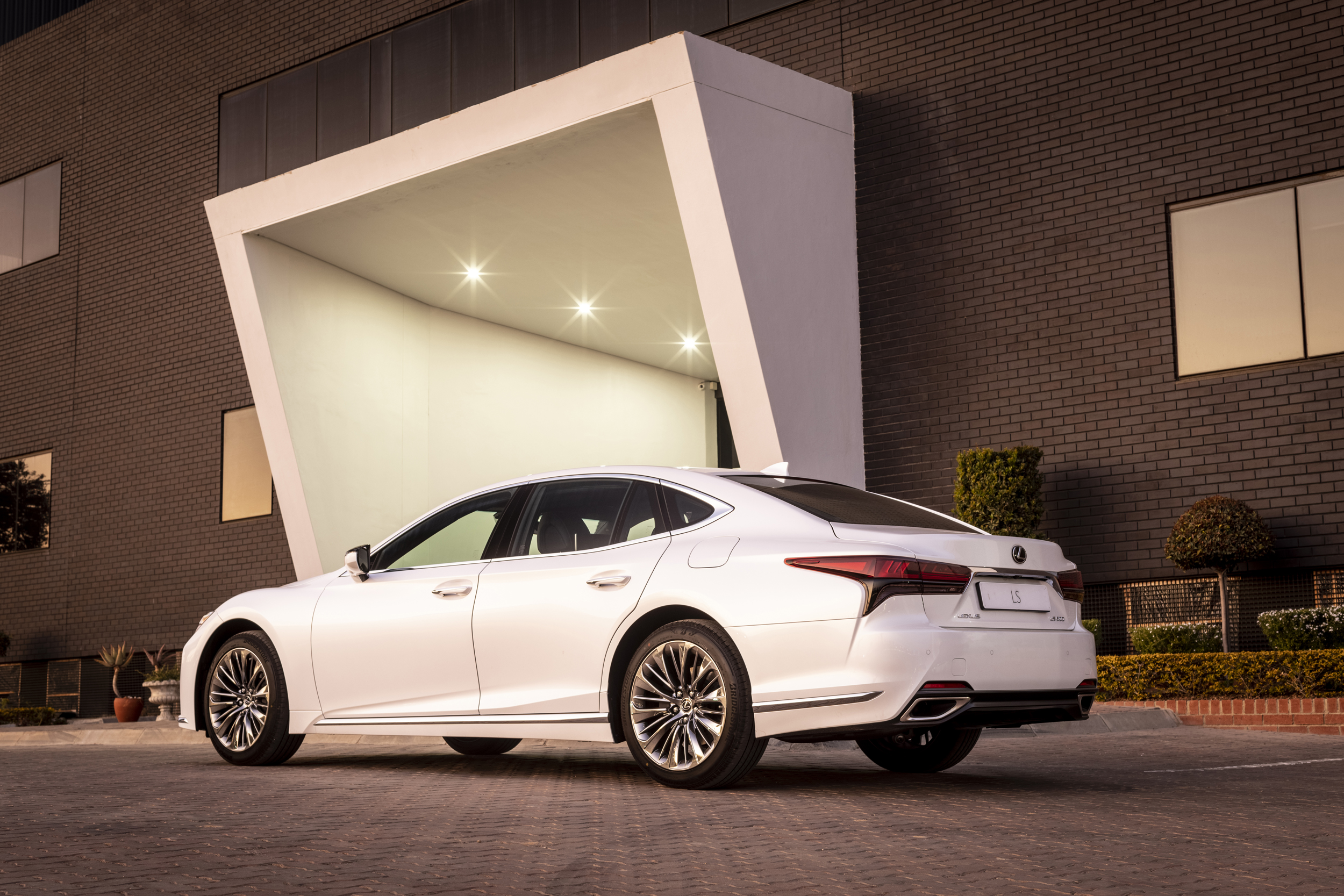 Lexus LS 500 luxury car at modern building entrance HD Wallpaper