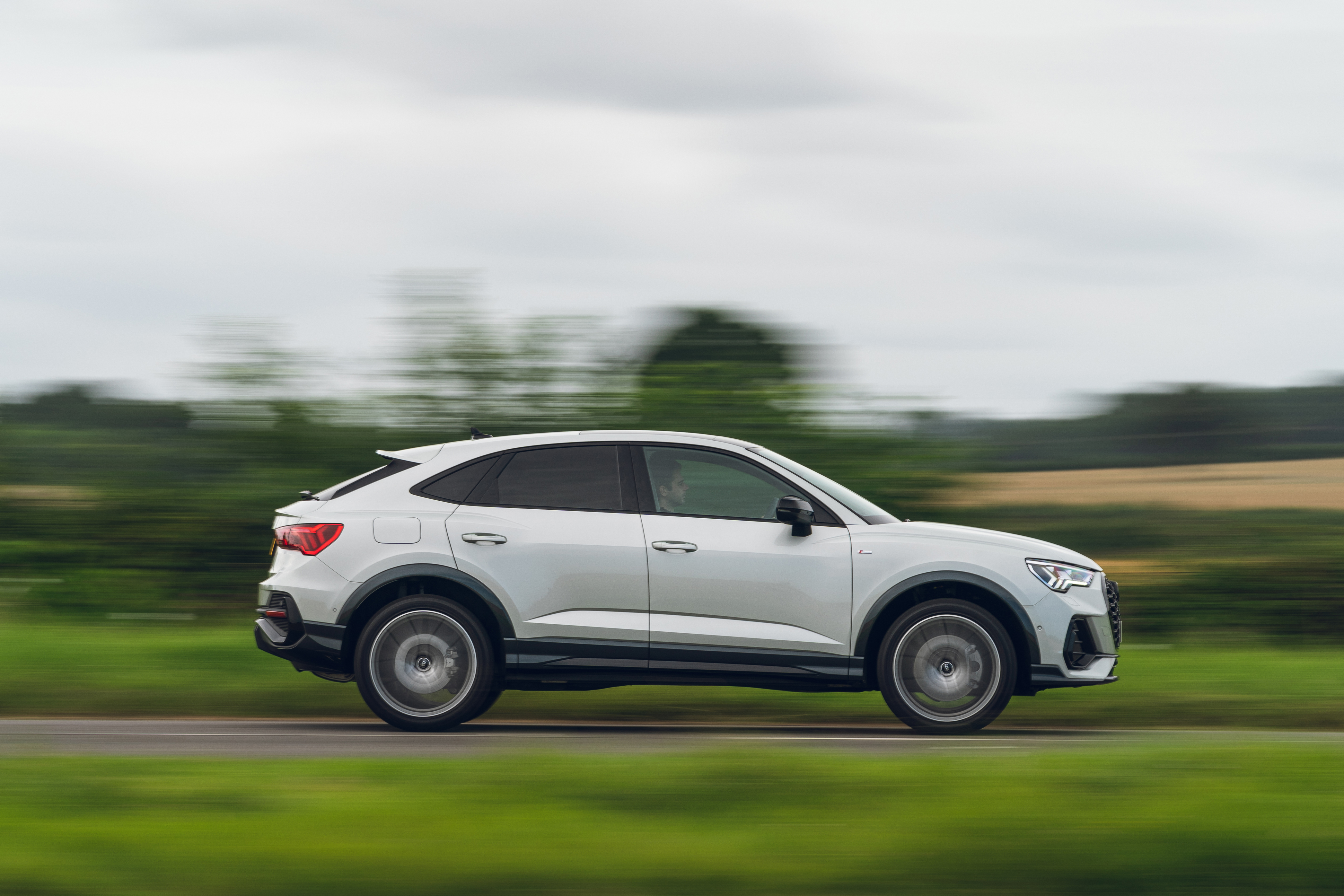 White Audi Q3 Sportback S Line SUV driving HD Wallpaper