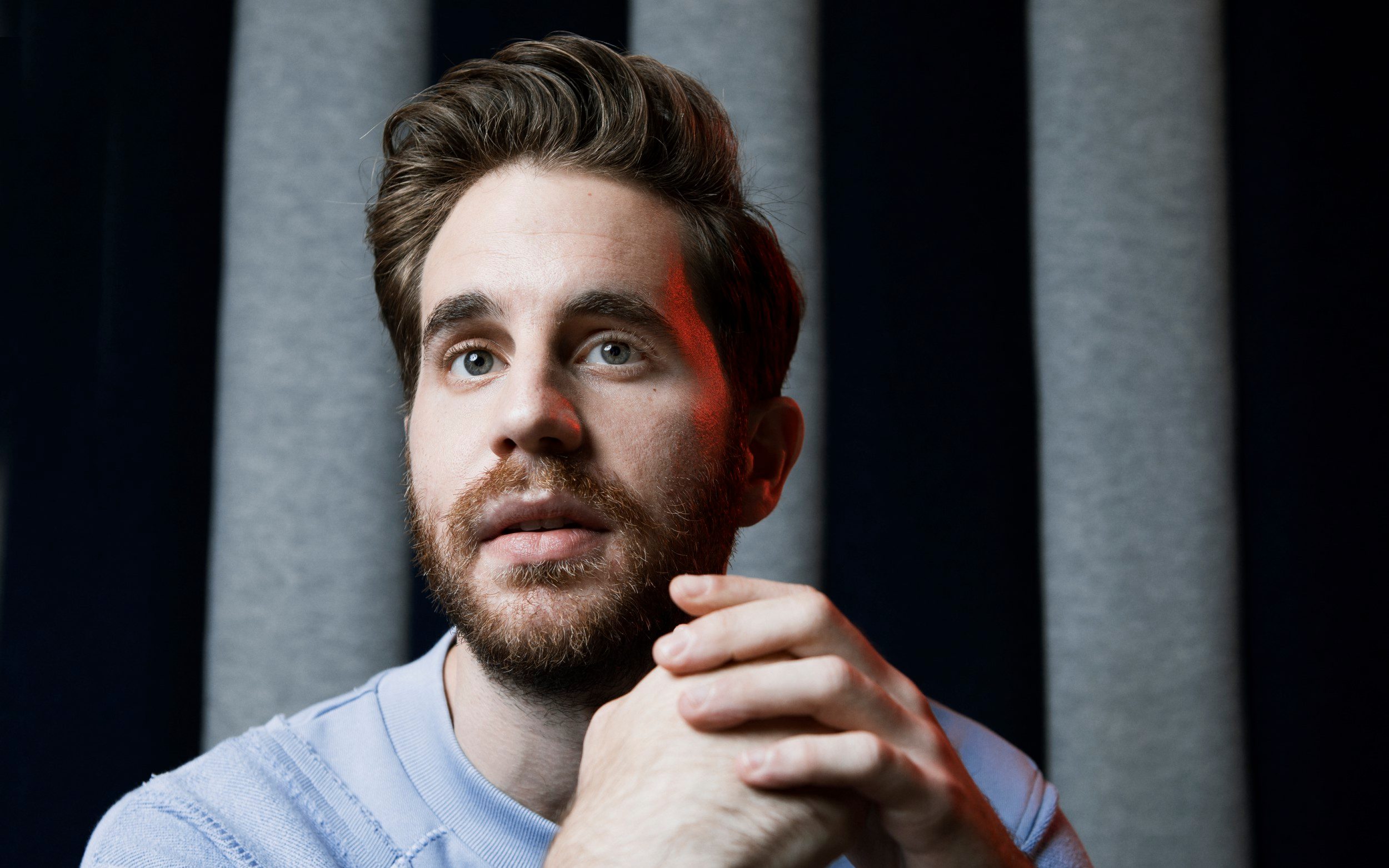 Ben Platt close-up portrait with clasped hands HD Wallpaper