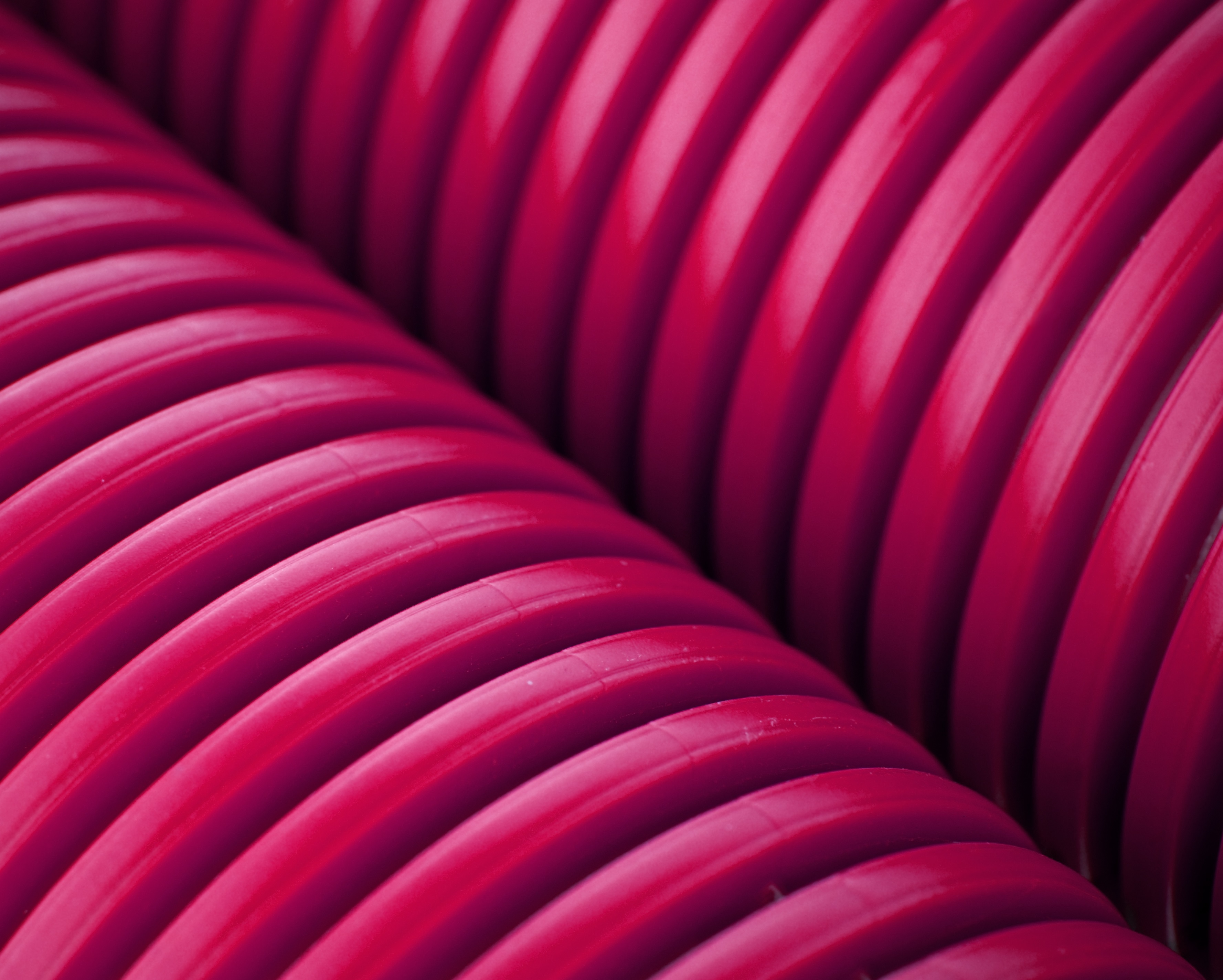 Vibrant Pink Corrugated Hoses Close Up HD Wallpaper
