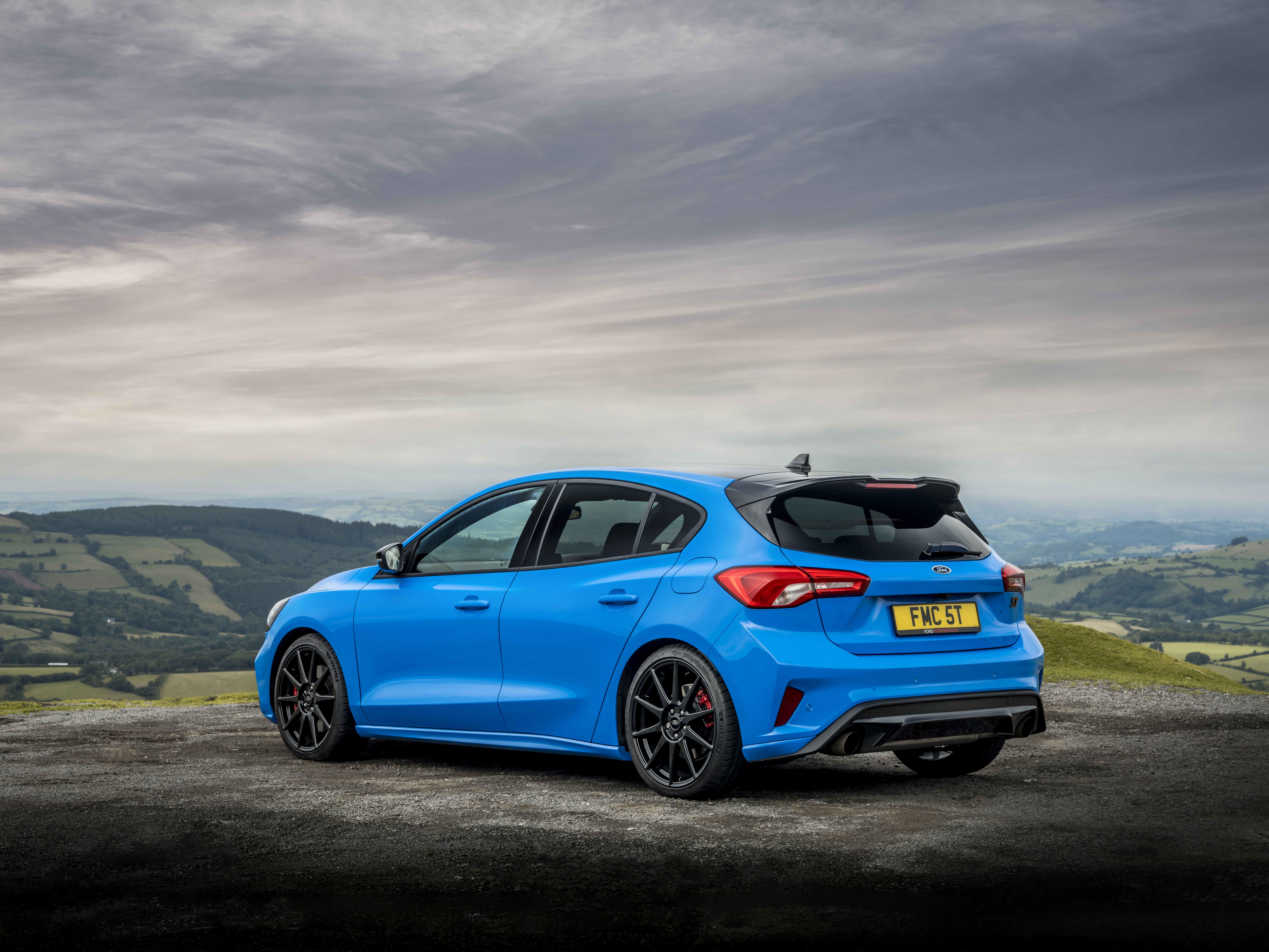 Blue Ford Focus ST on a scenic overlook HD Wallpaper