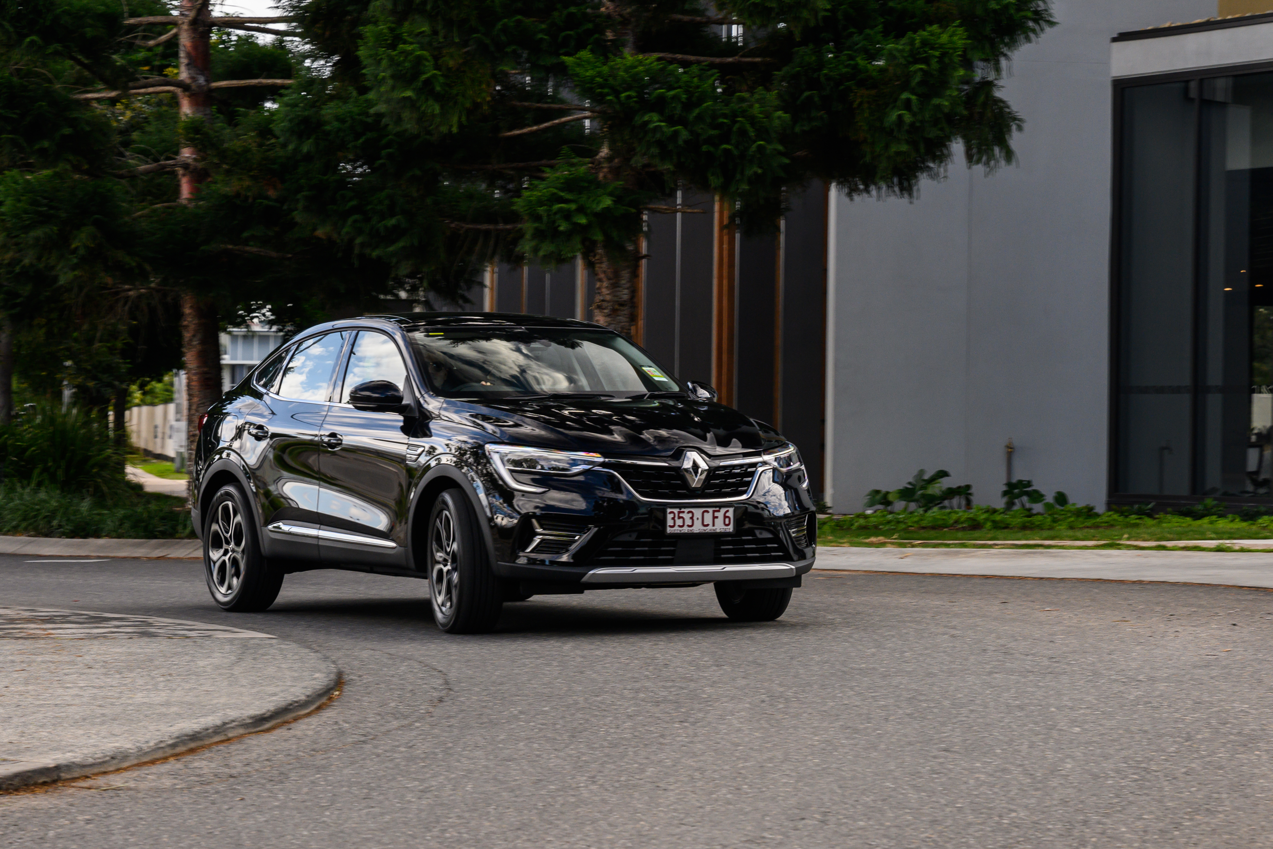 Black Renault Arkana SUV on road HD Wallpaper