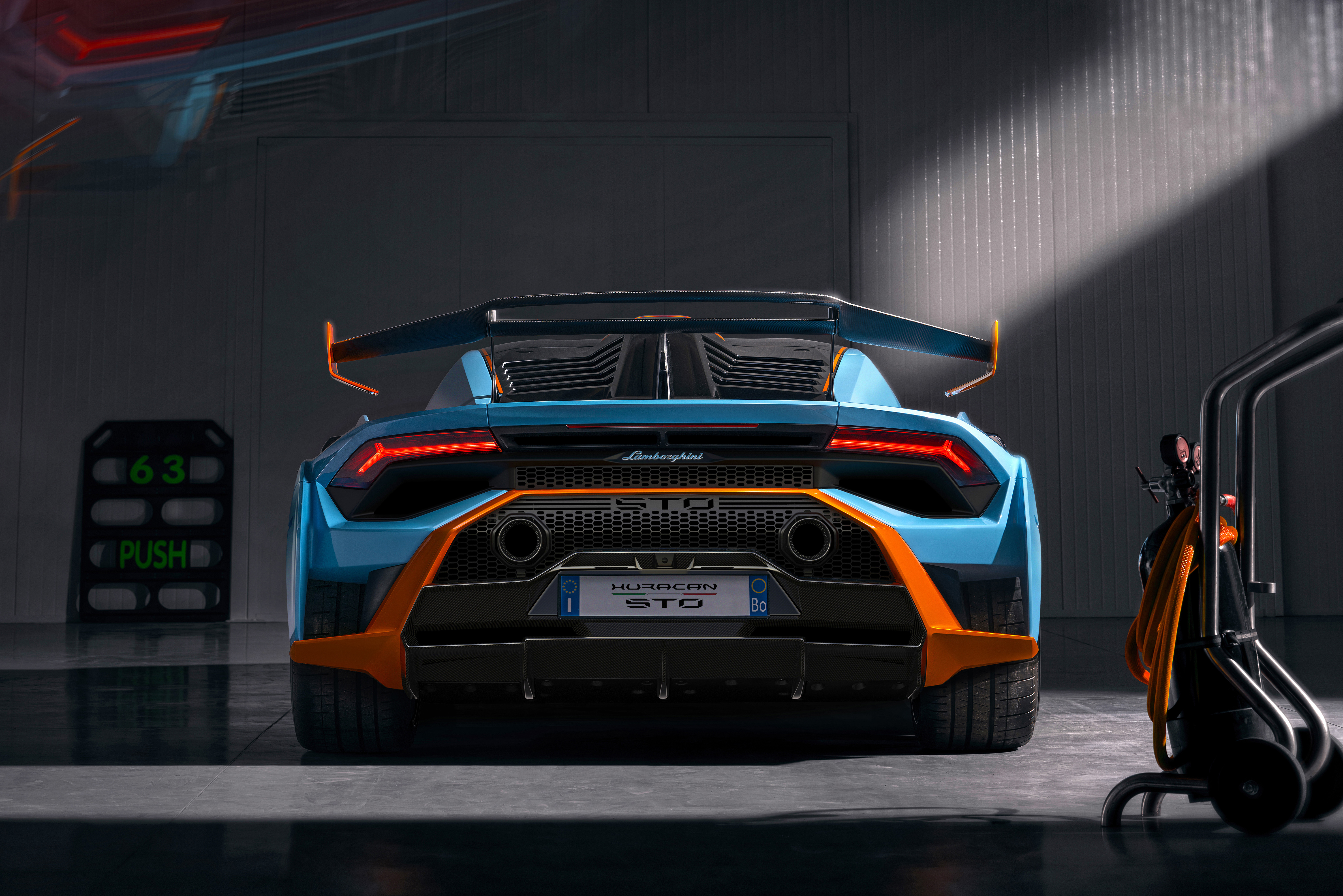 Blue and orange Lamborghini Huracán STO supercar rear view HD Wallpaper