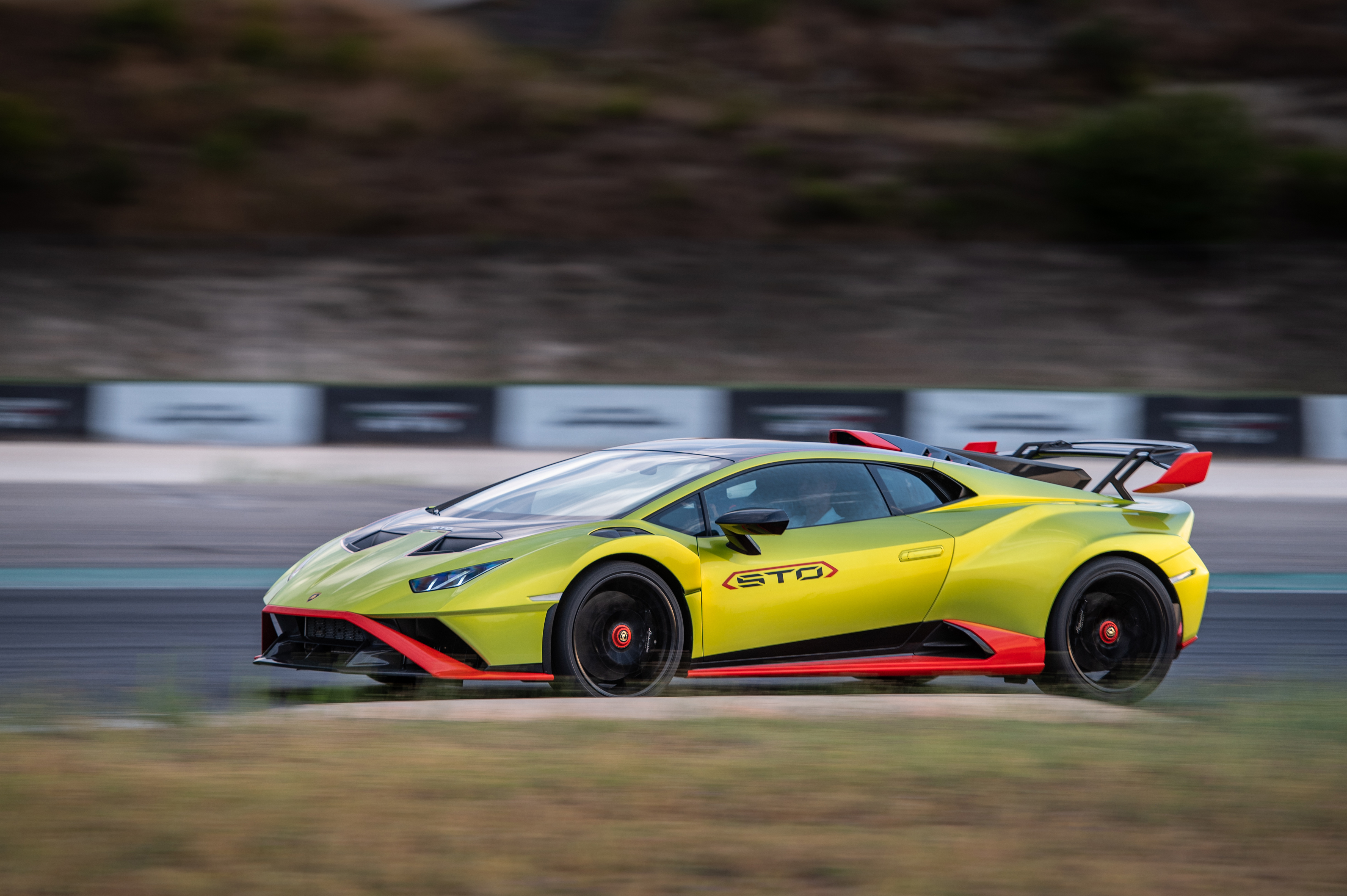 Green Lamborghini Huracán STO speeding on track HD Wallpaper