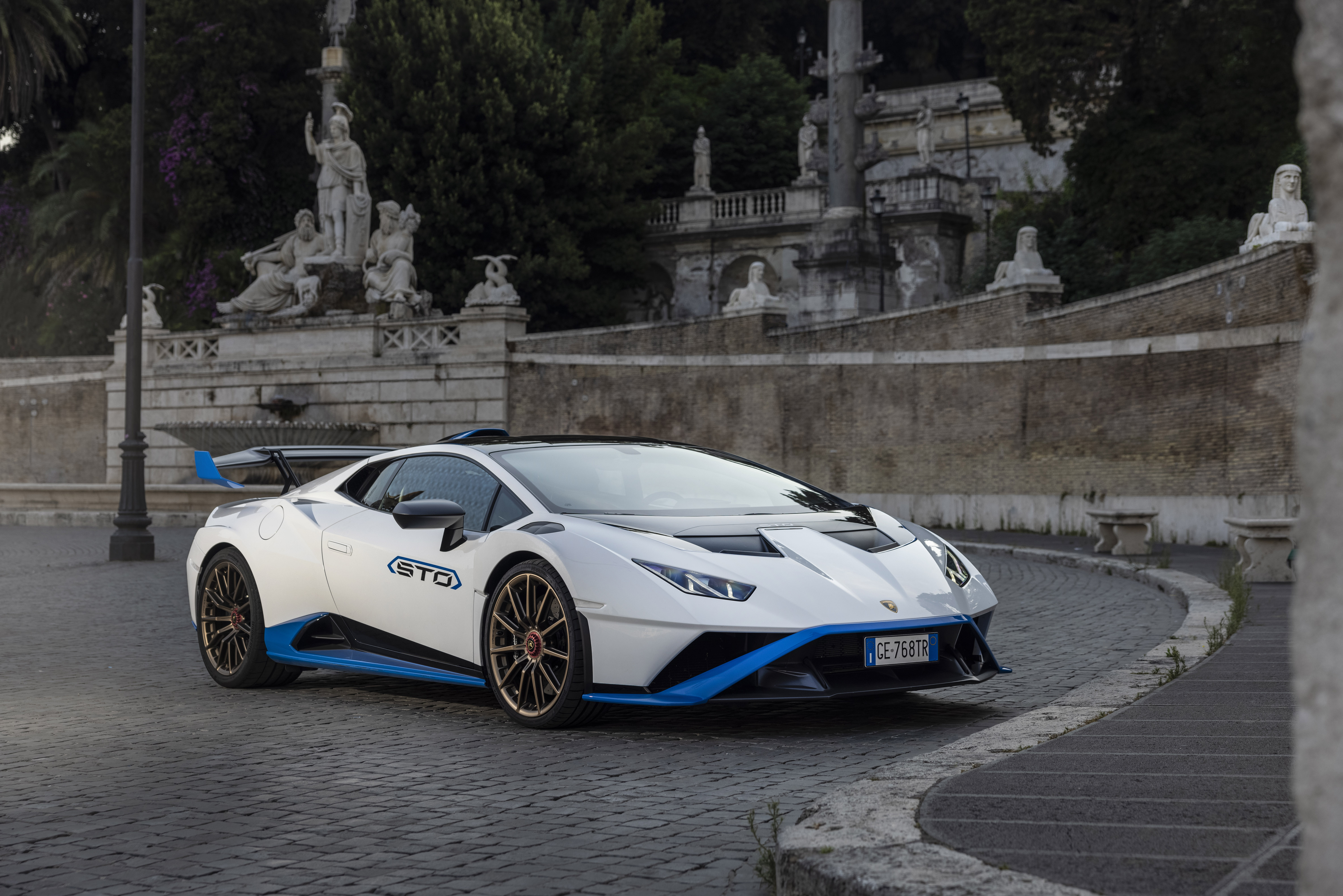 White Lamborghini Huracán STO Supercar on Cobblestone Street HD Wallpaper
