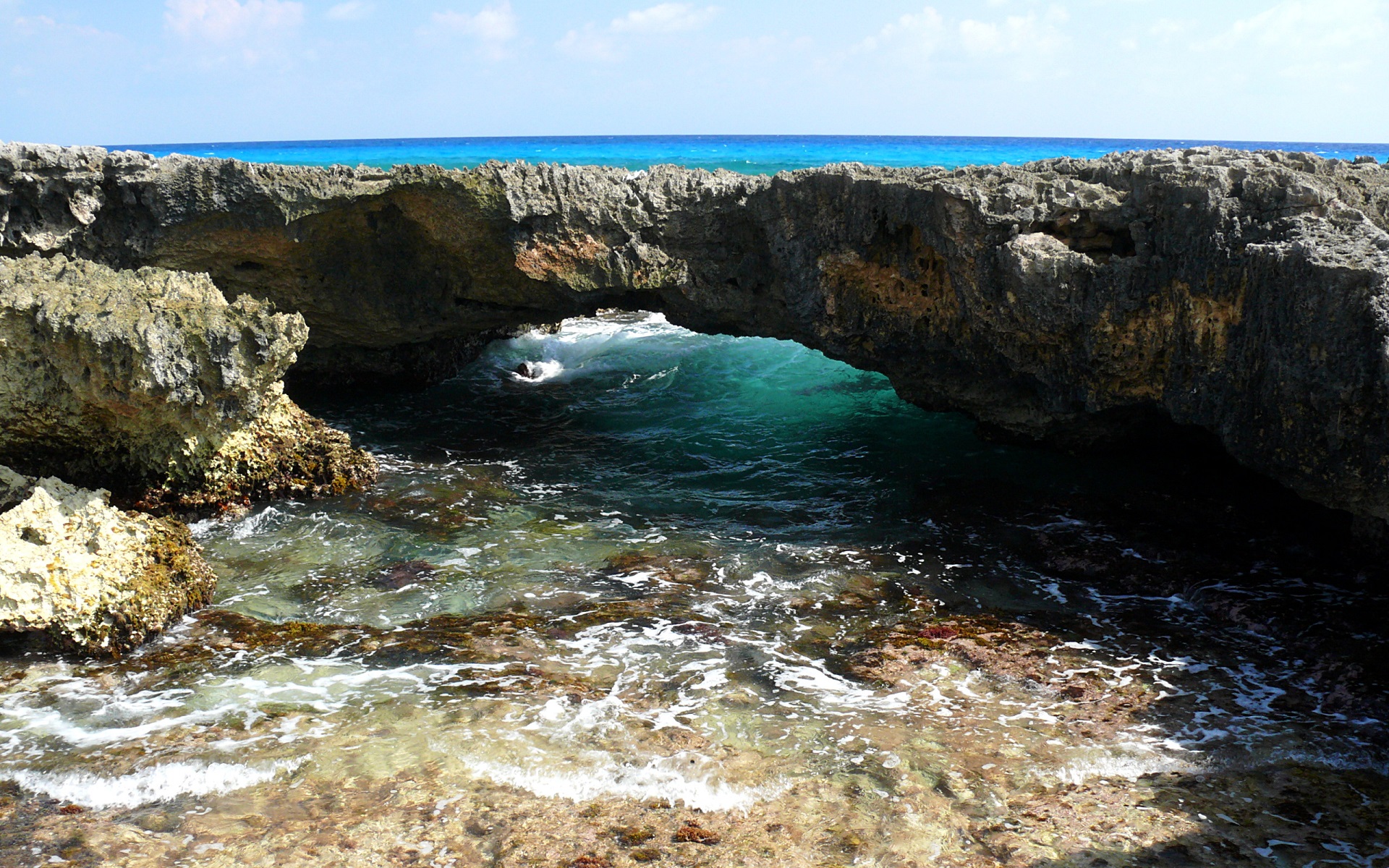Cozumel natural rock arch over turquoise ocean HD Wallpaper