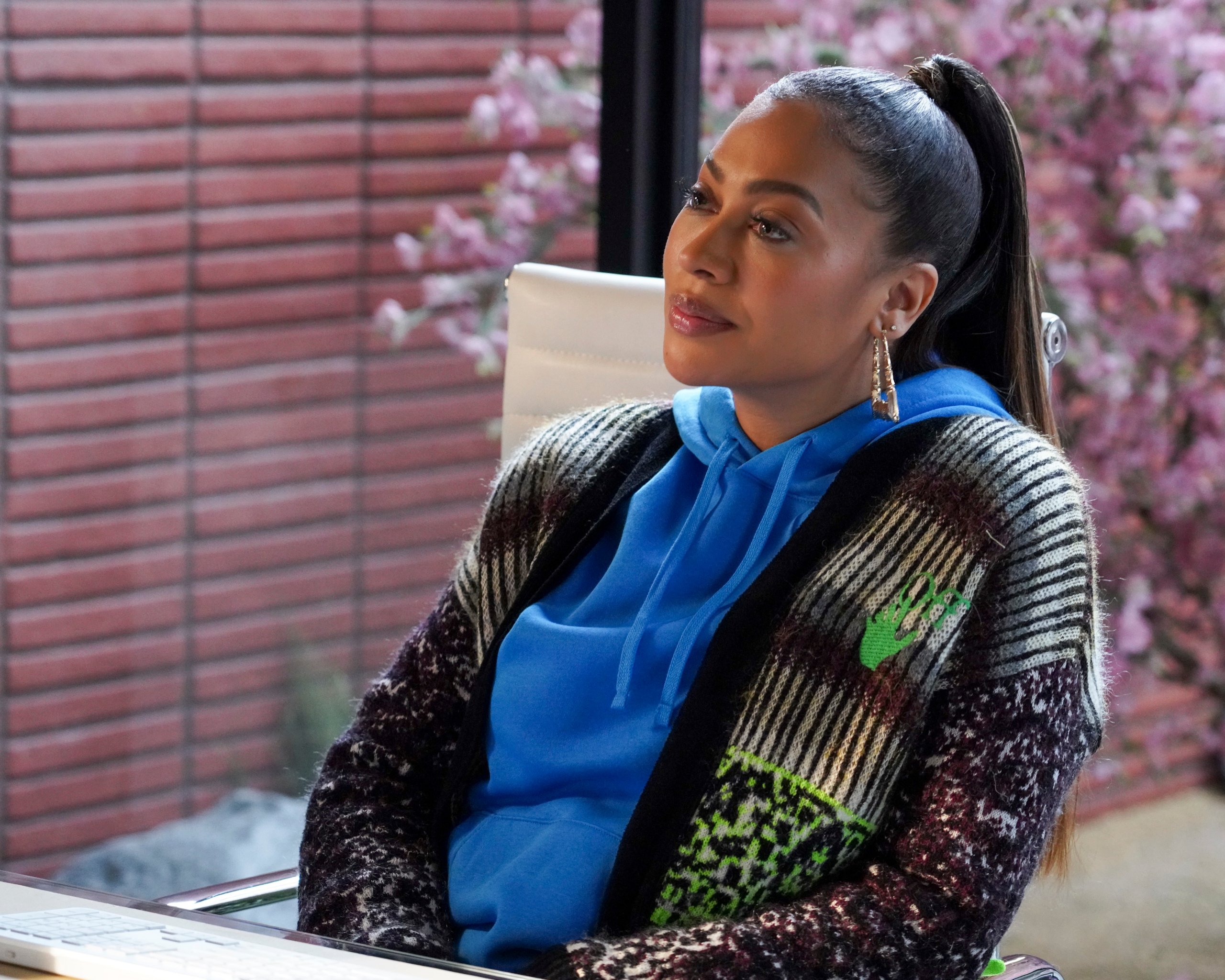 La La Anthony in blue hoodie and patterned cardigan HD Wallpaper