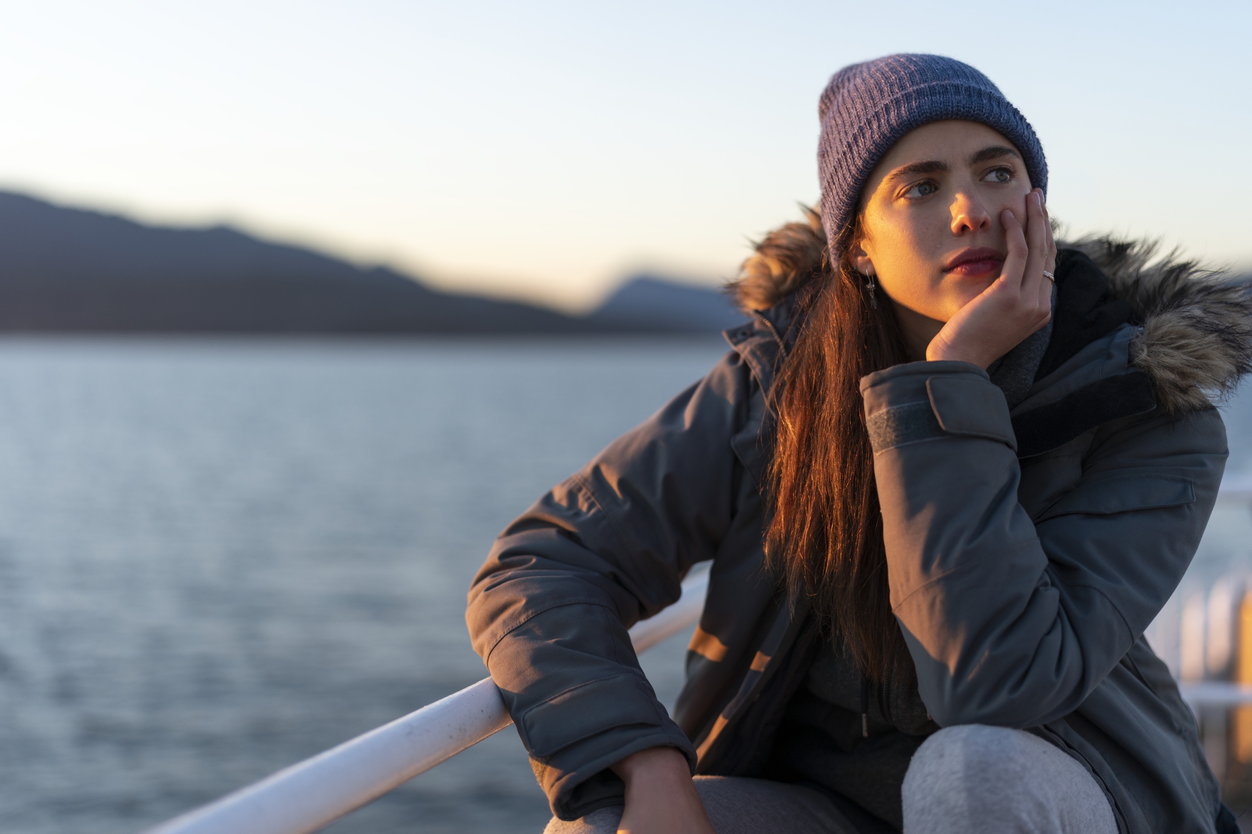 Margaret Qualley in Maid looking at sunset over water HD Wallpaper