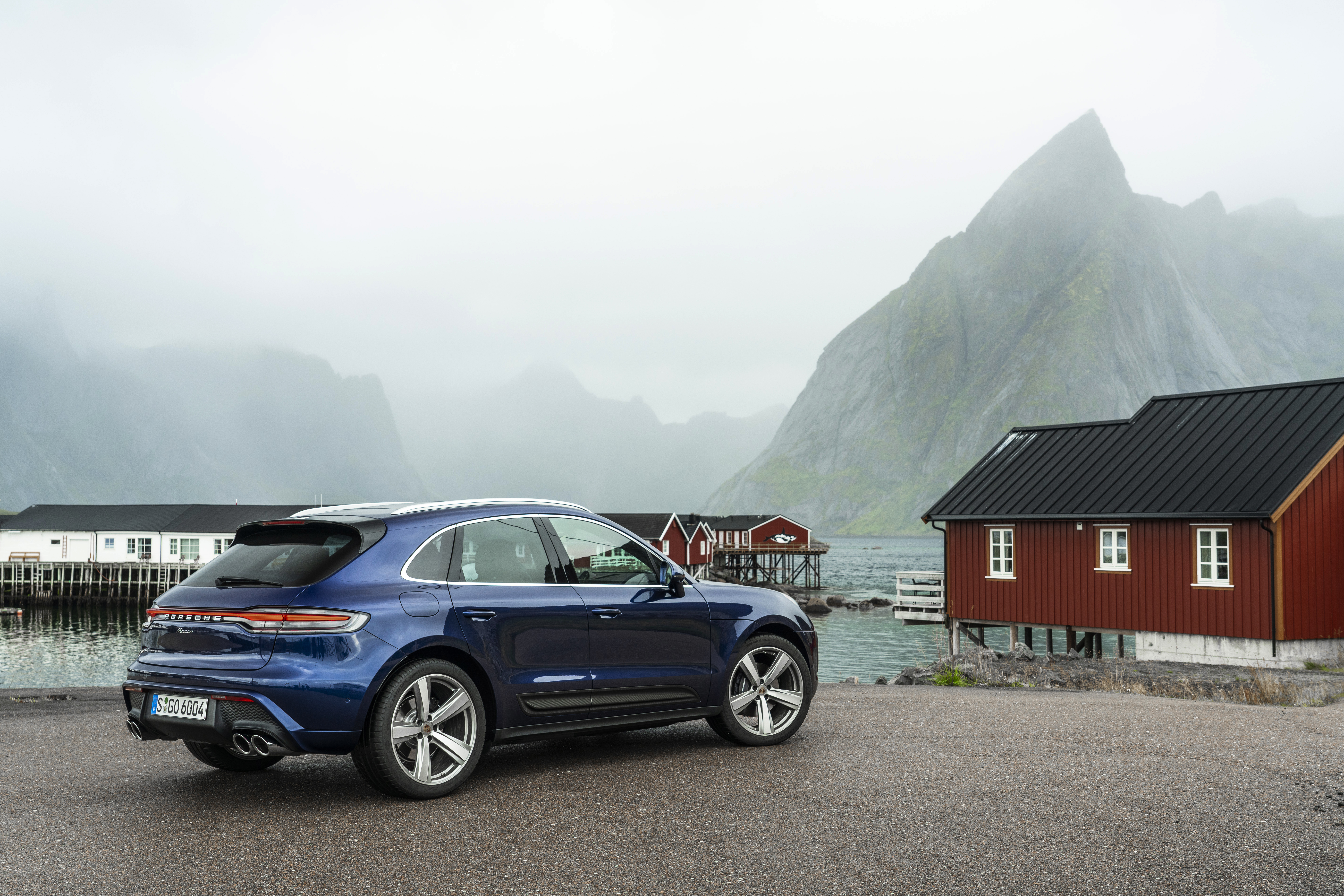 Luxury Blue Porsche Macan SUV by a Norwegian fjord HD Wallpaper
