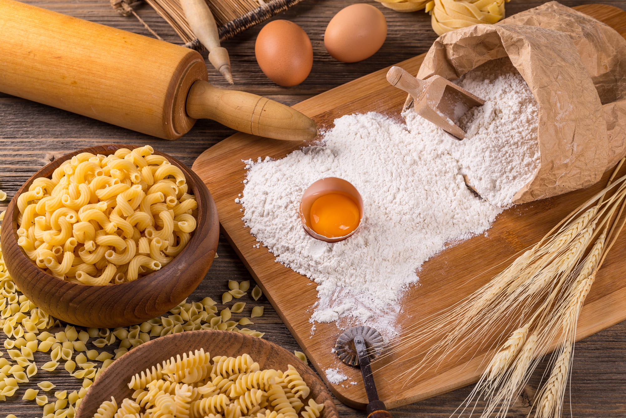 Still life of pasta, flour, eggs, and wheat HD Wallpaper
