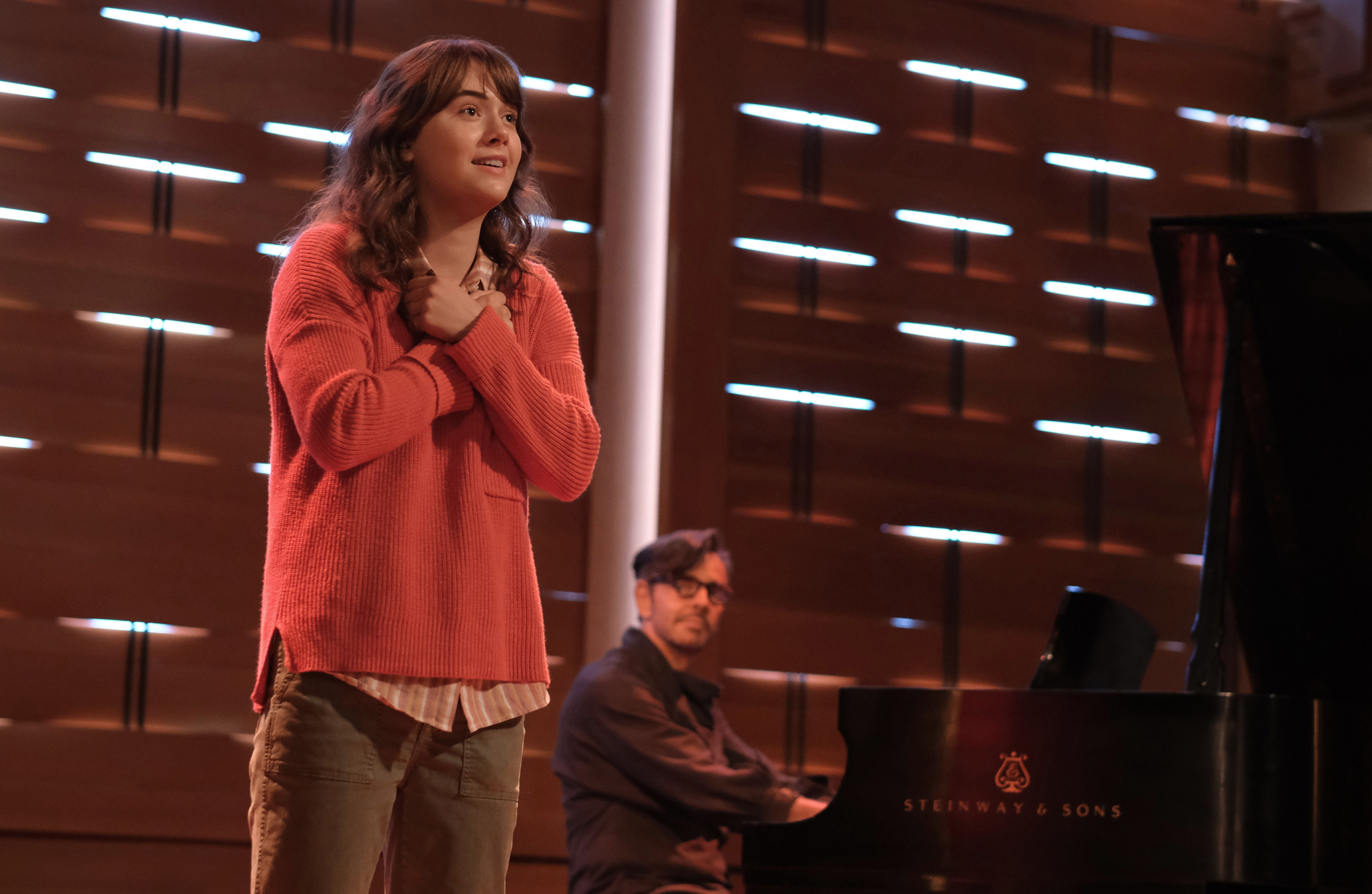 Emilia Jones singing with pianist in CODA HD Wallpaper