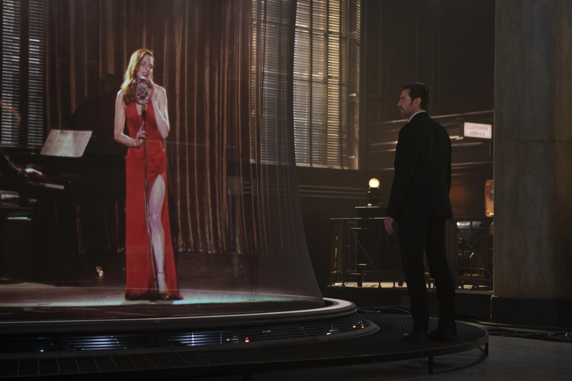 Hugh Jackman watches a holographic singer in Reminiscence HD Wallpaper