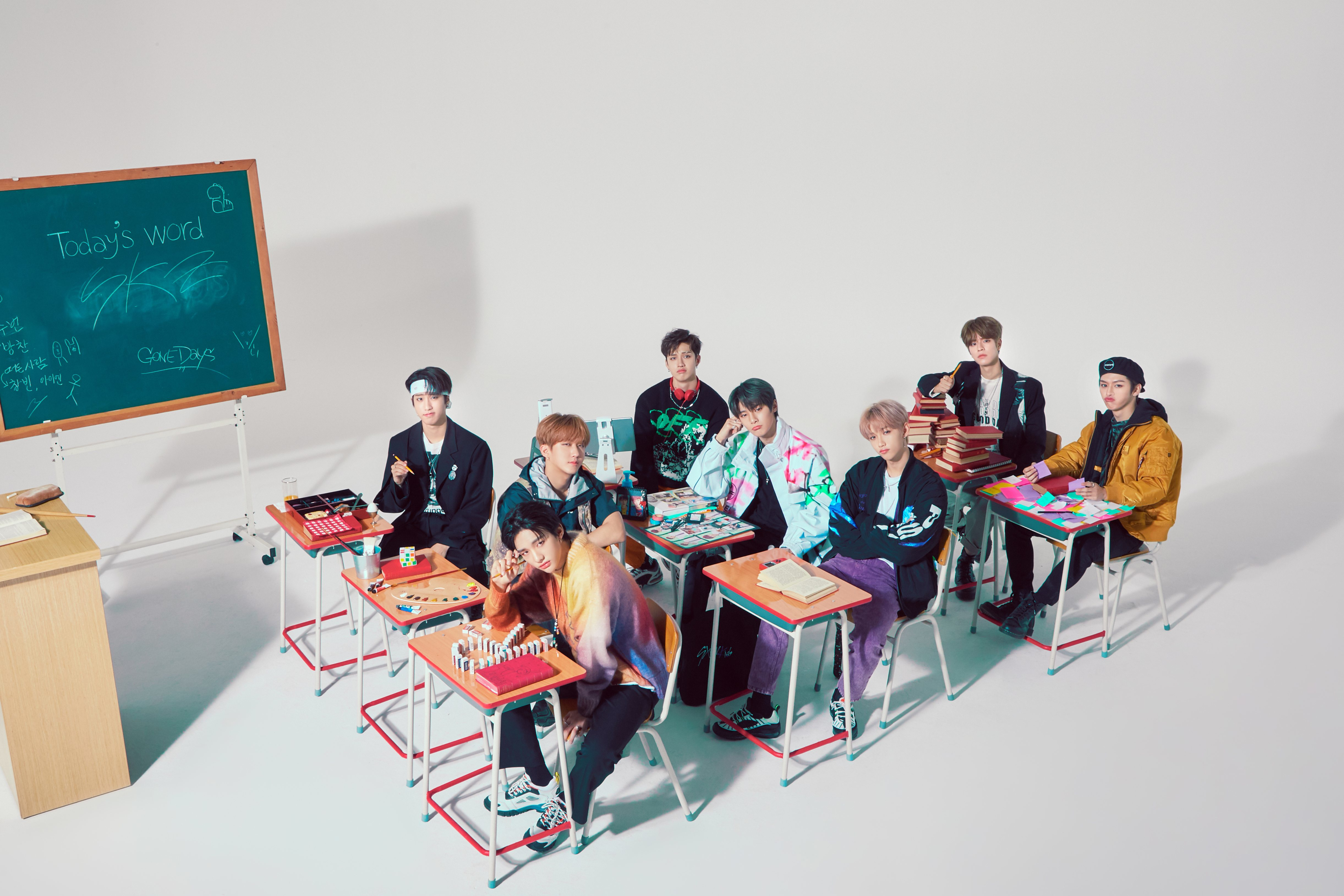 Stray Kids K-Pop boy band in a classroom setting HD Wallpaper