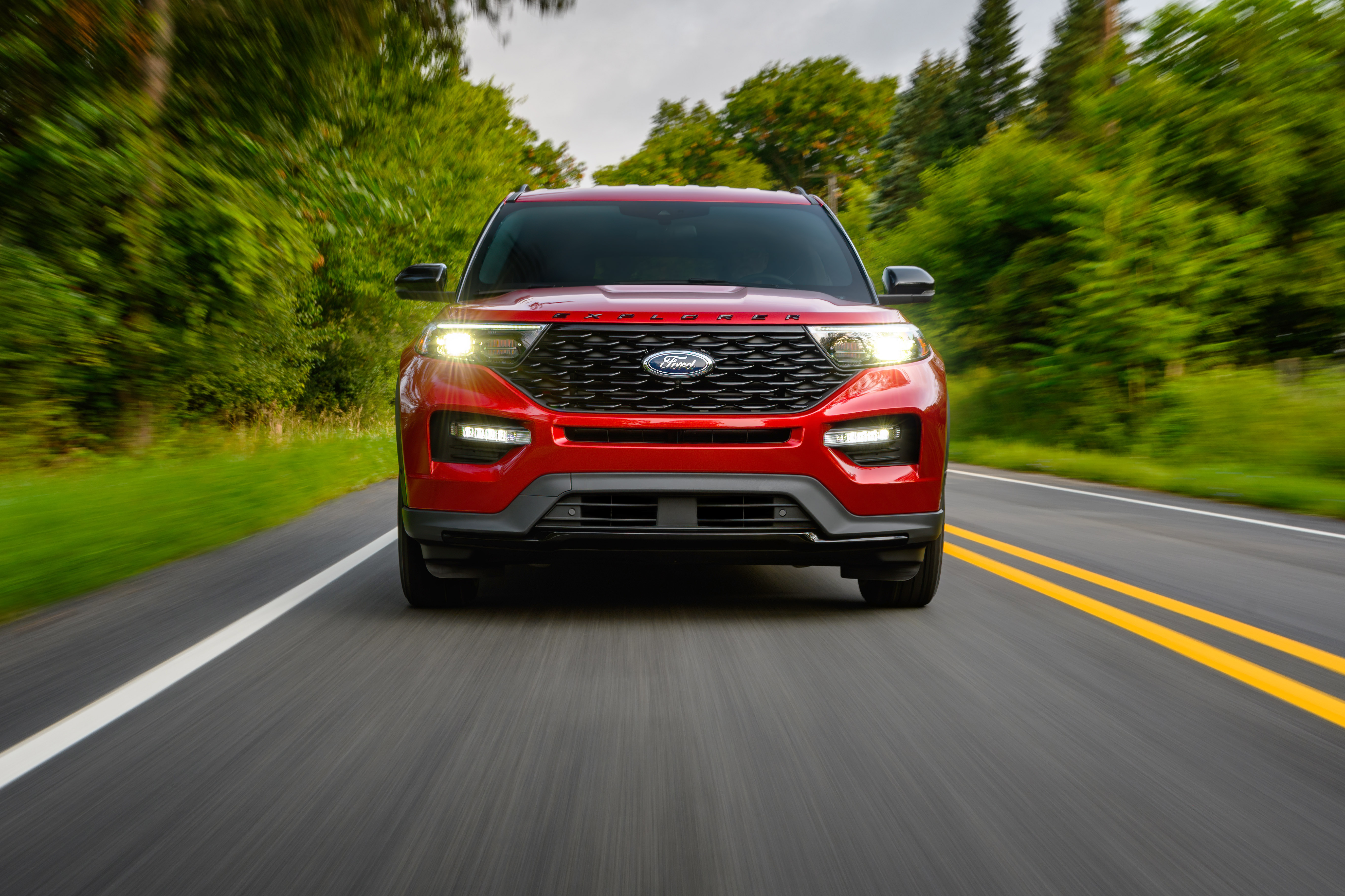 Red Ford Explorer ST-Line SUV driving on road HD Wallpaper