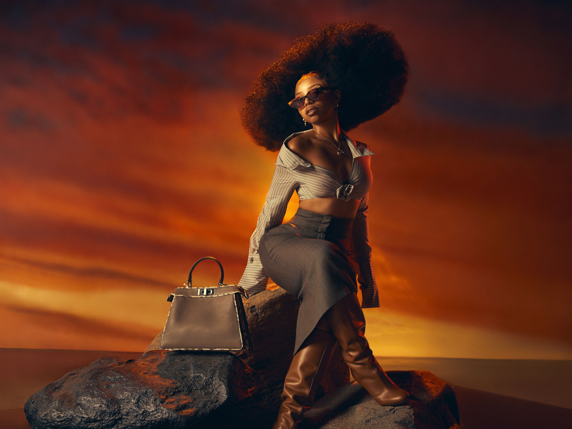 Chloe Bailey fashion shoot with handbag at sunset HD Wallpaper