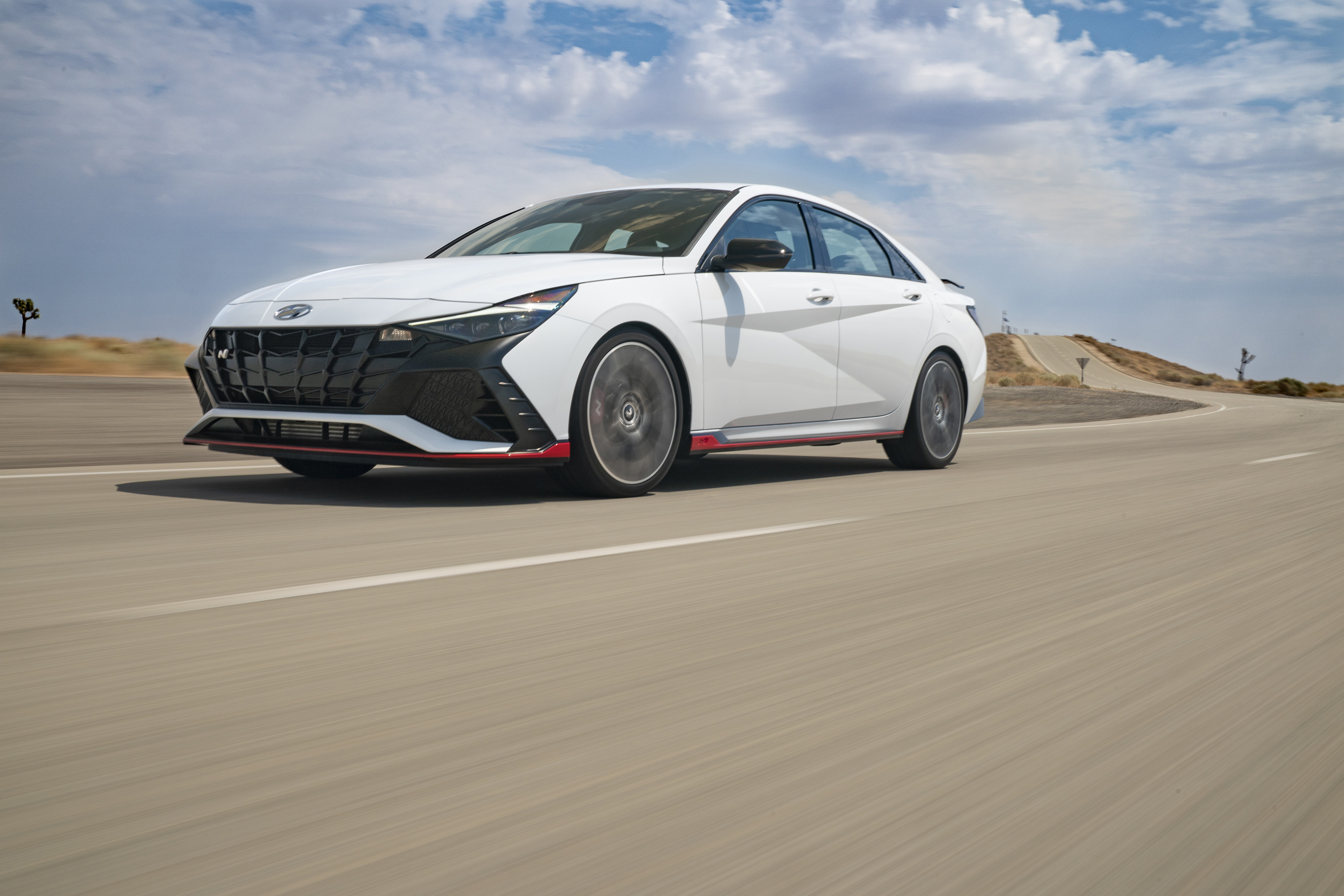 2022 Hyundai Elantra N sport car on a winding road HD Wallpaper