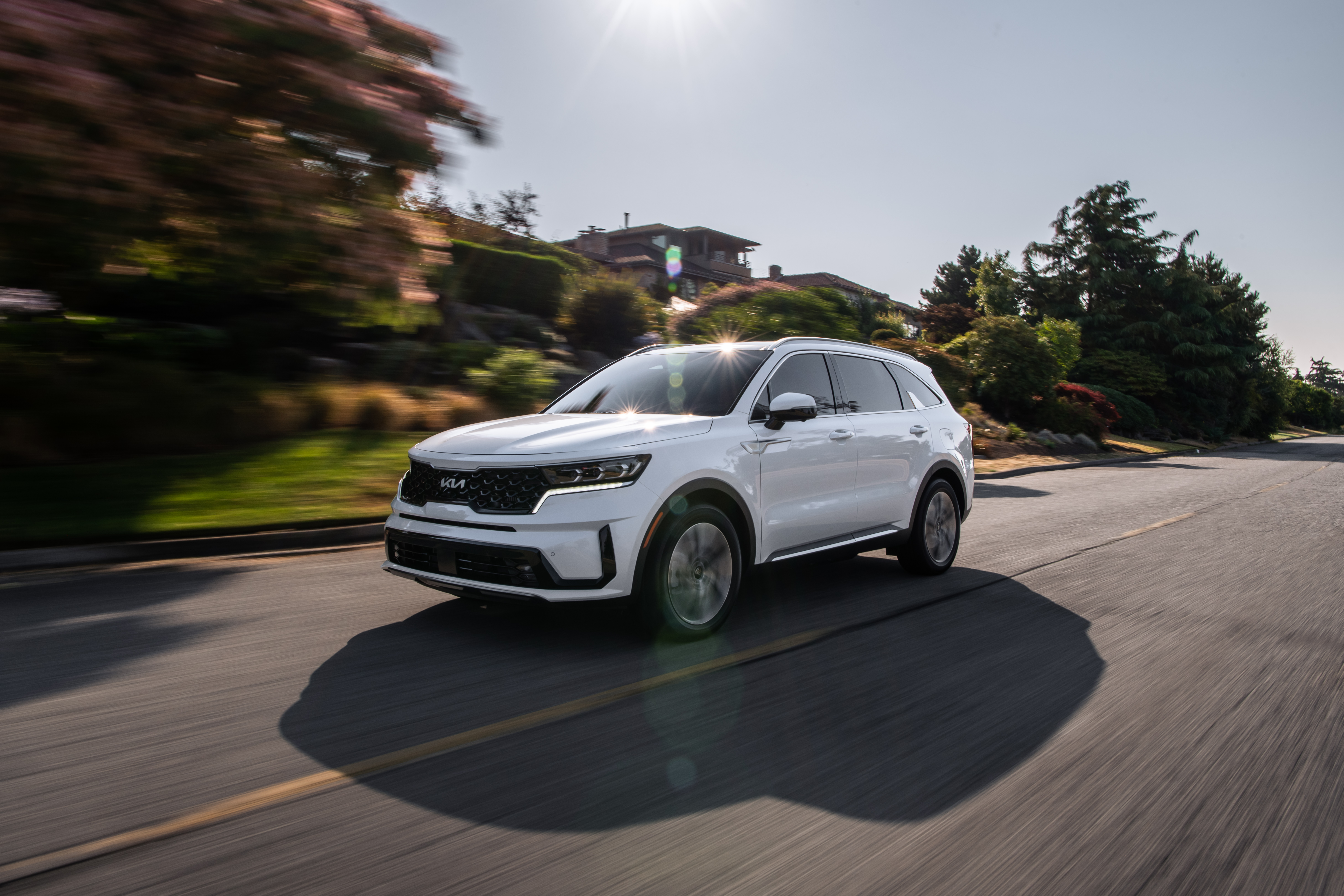 2022 Kia Sorento PHEV SUV driving on sunny road HD Wallpaper