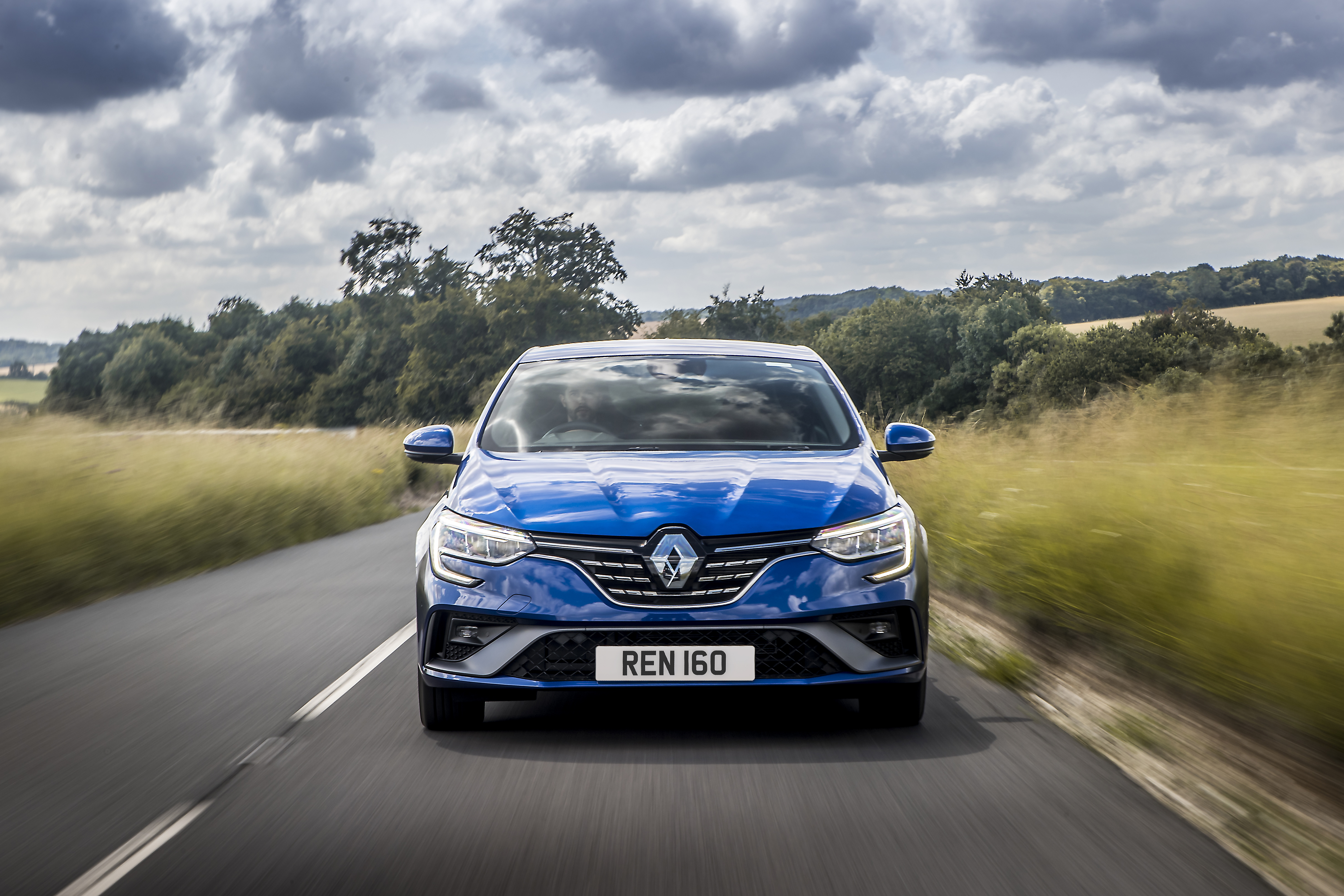 Blue Renault Mégane E-TECH electric car on road HD Wallpaper