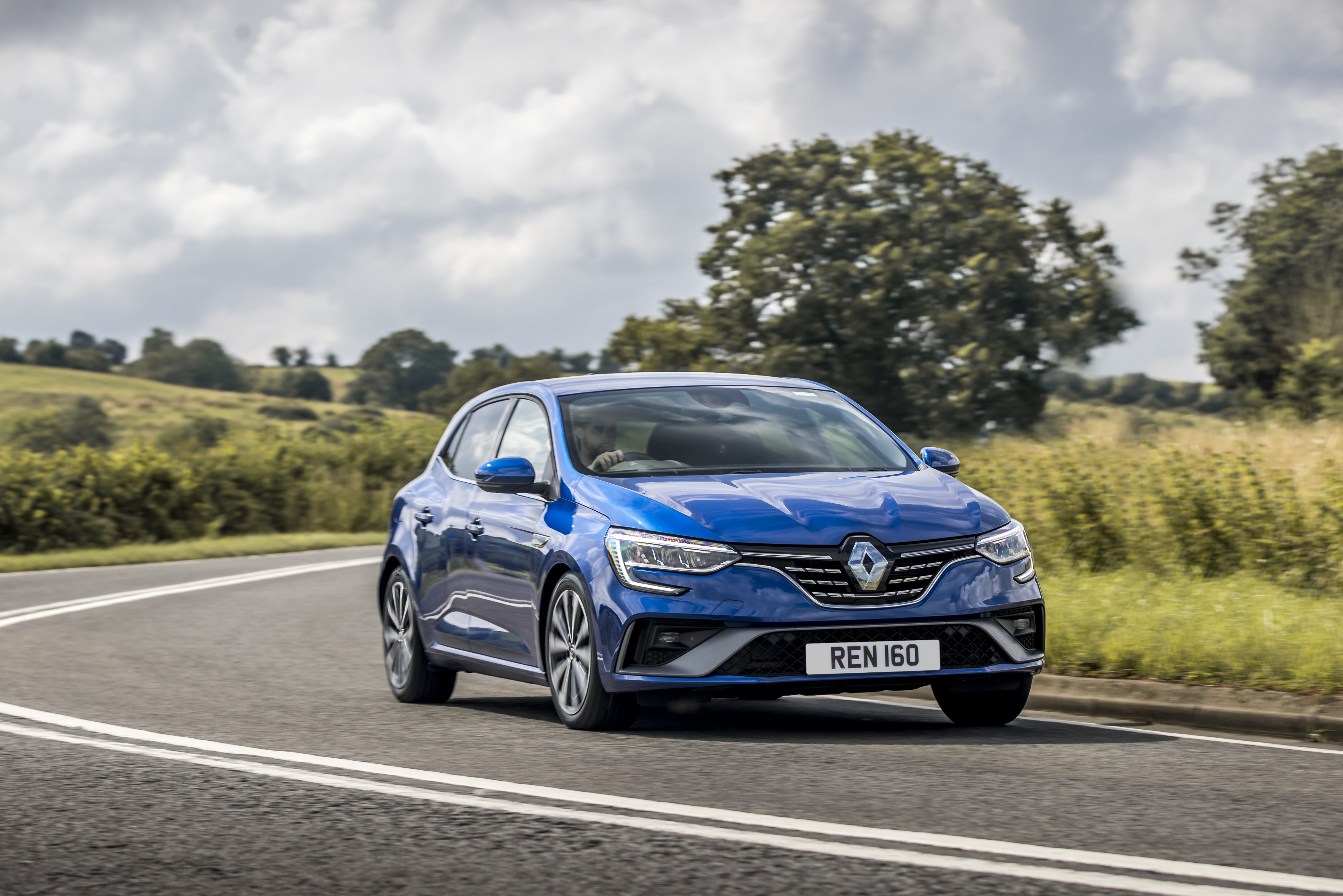 Blue Renault Mégane E-TECH Plug-in Hybrid driving on road HD Wallpaper