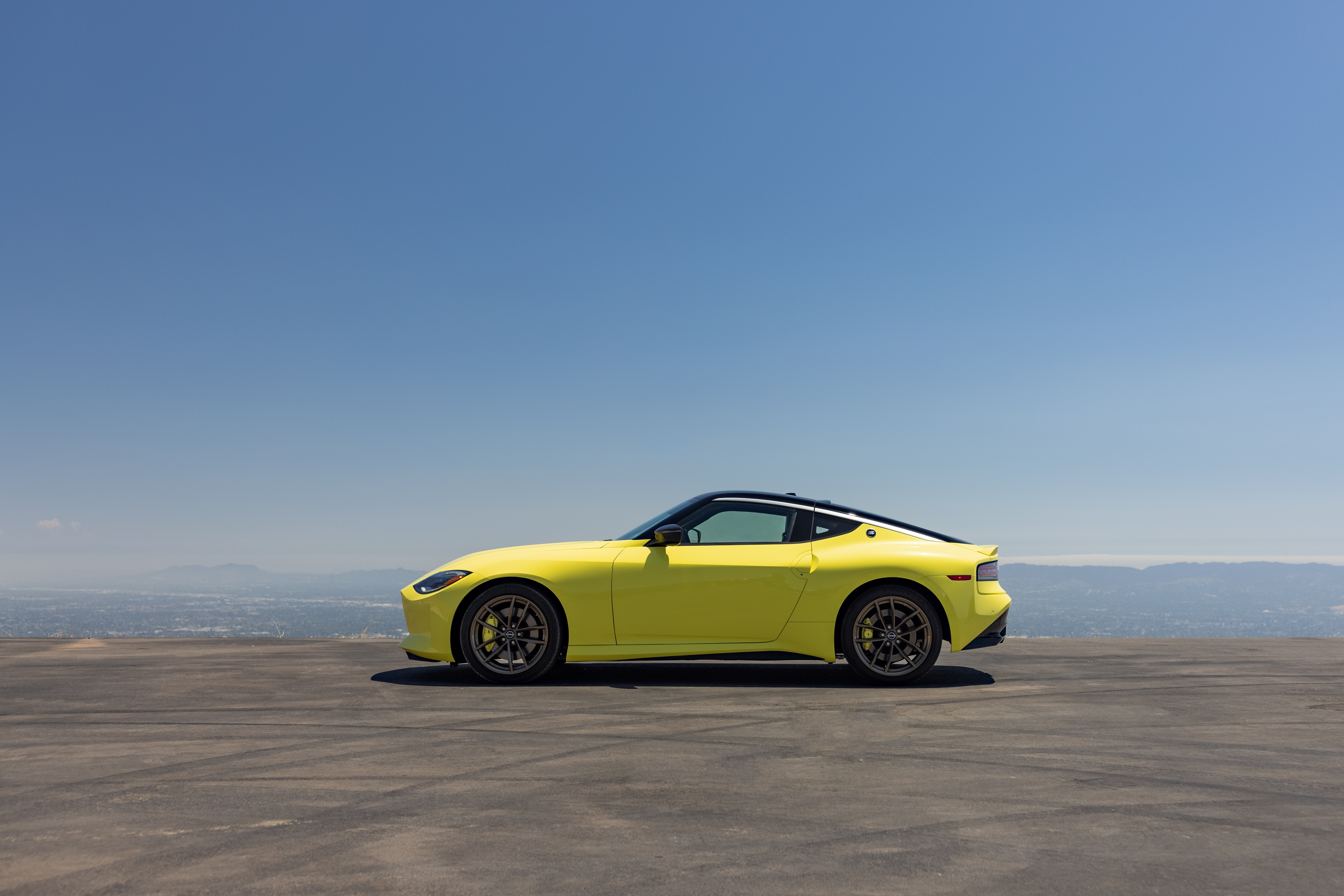 Yellow Nissan Z Proto Spec on a Scenic Overlook HD Wallpaper