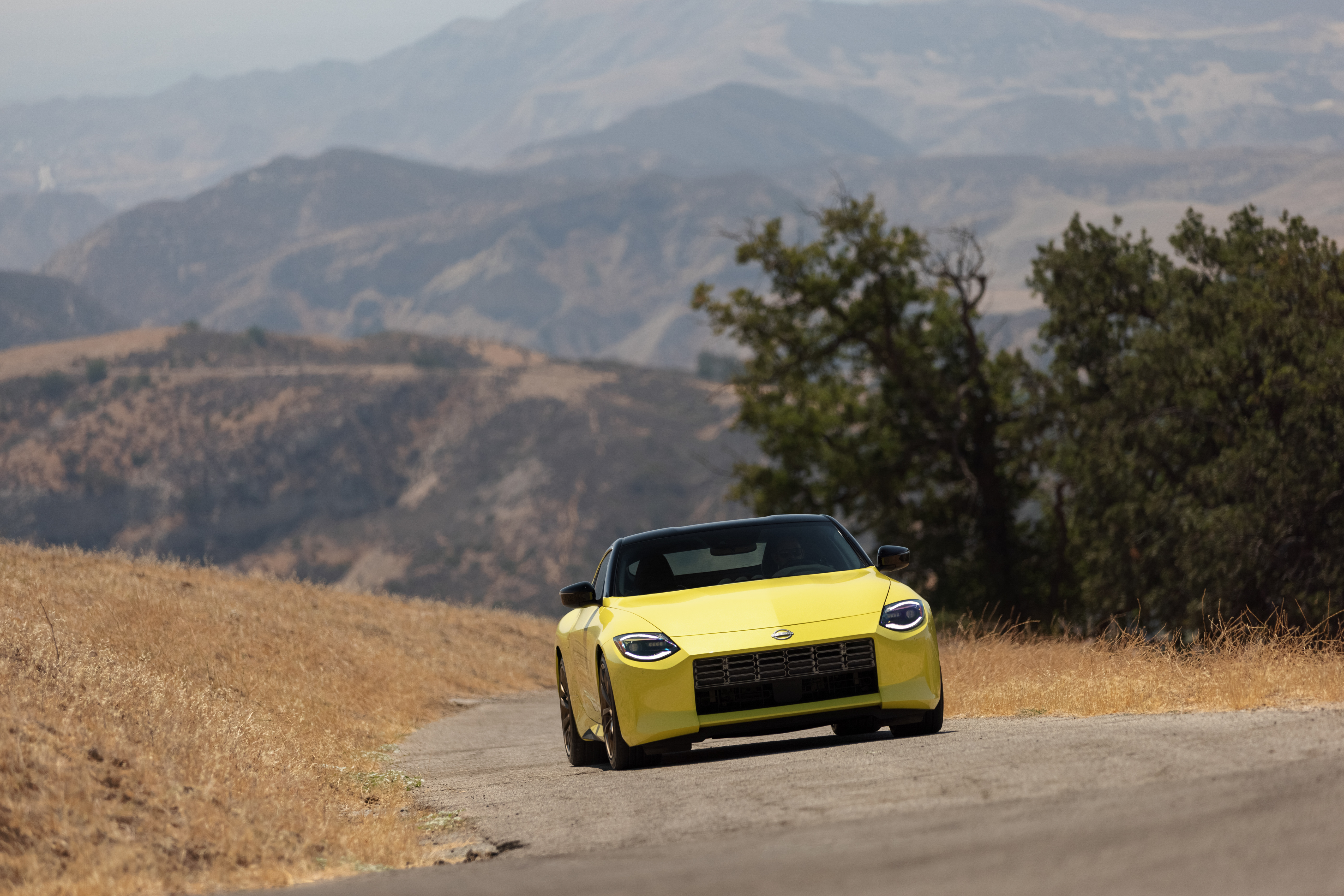 Yellow Nissan Z Sport Car on Mountain Road HD Wallpaper