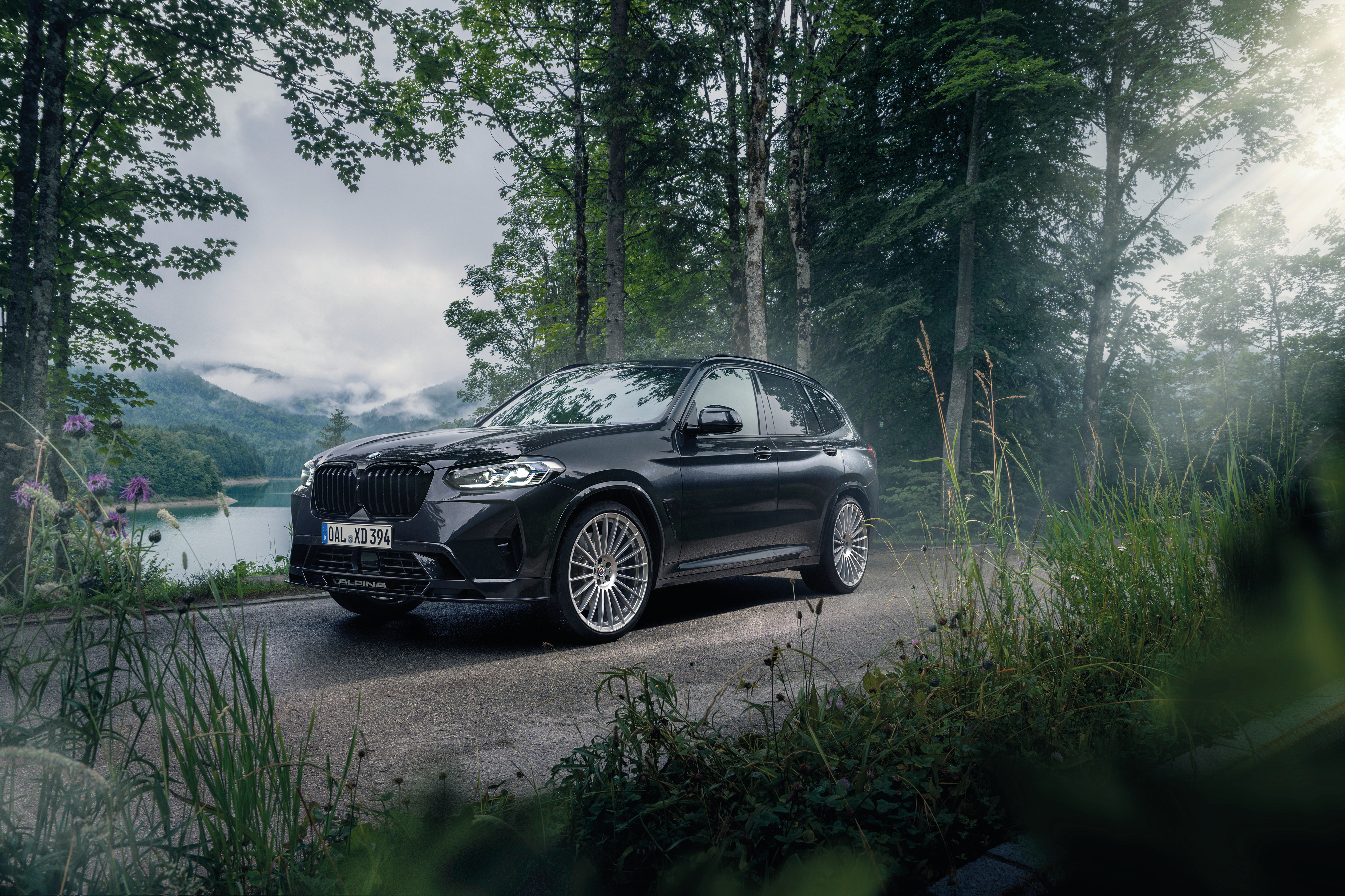BMW Alpina XD3 SUV by a scenic mountain lake HD Wallpaper