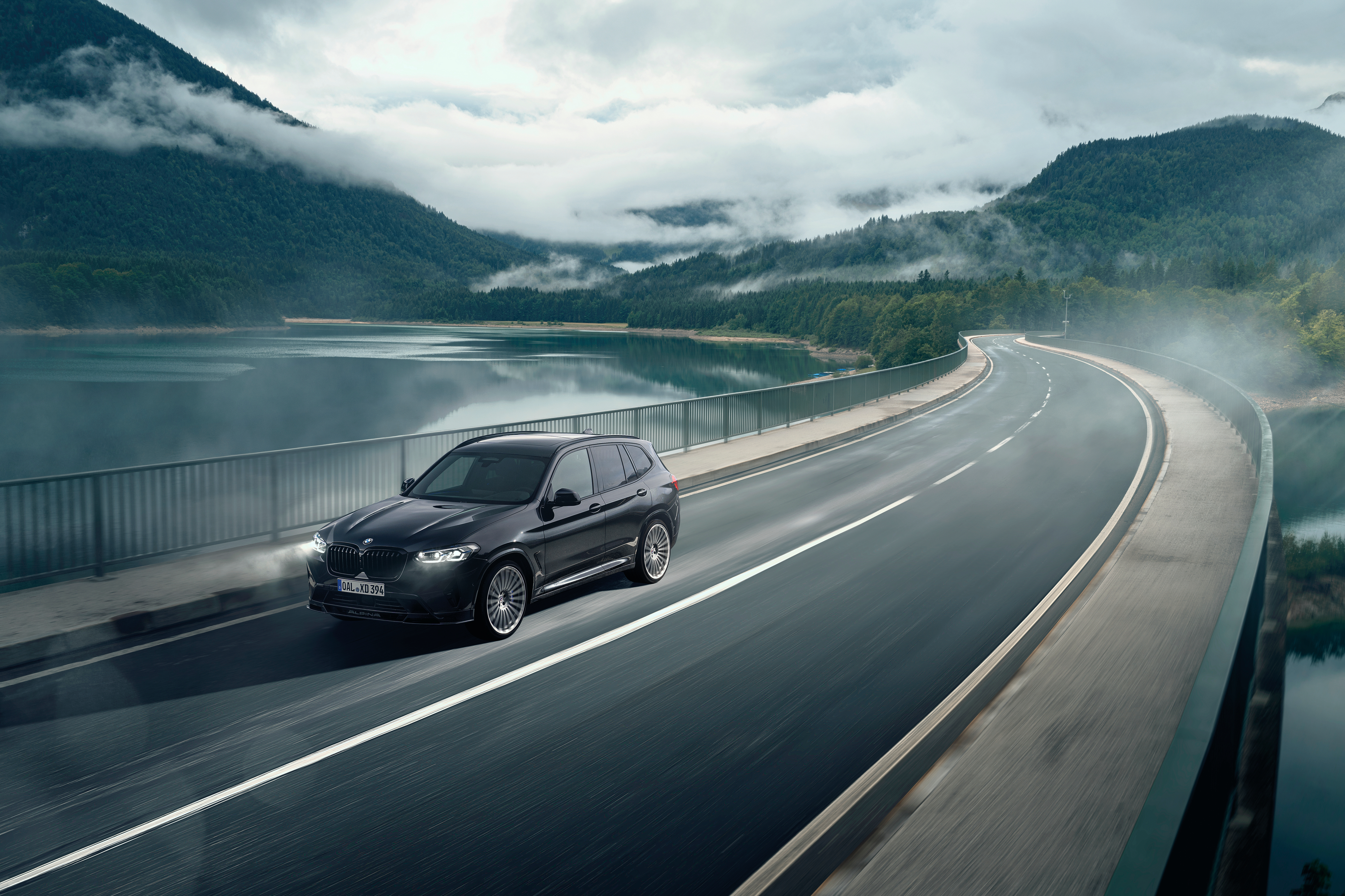 BMW Alpina XD3 SUV on a misty mountain lake road HD Wallpaper